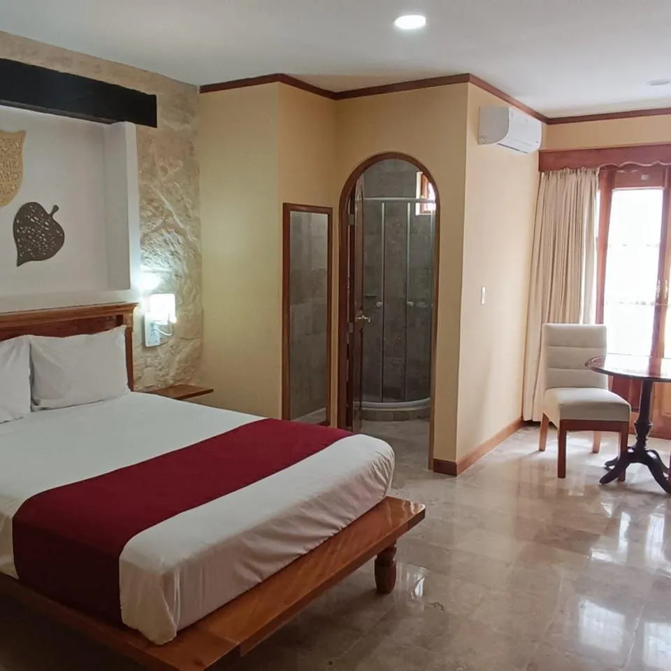 Bed in Cancun International Suites