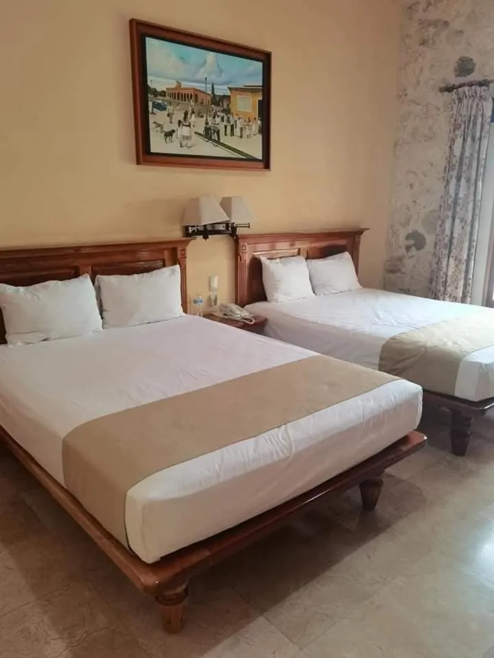 Bed in Cancun International Suites