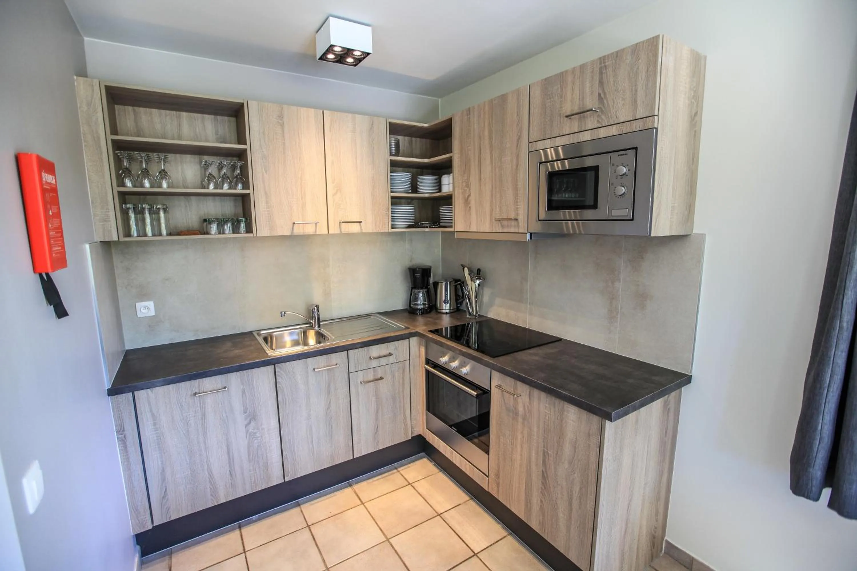 Kitchen or kitchenette in Maisons de Vacances Azur en Ardenne