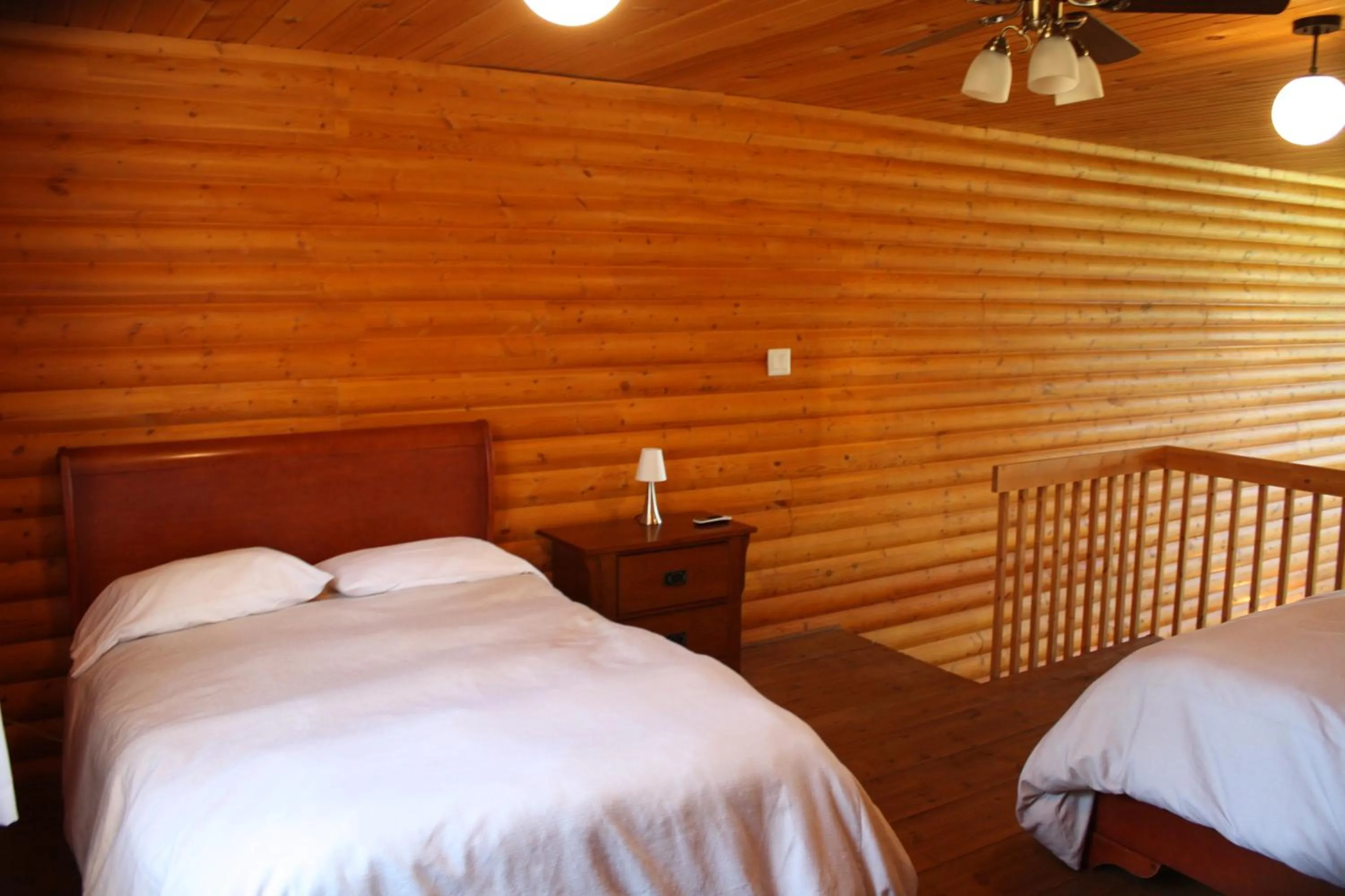 Bedroom, Bed in Chalets et Spa Lac Saint-Jean