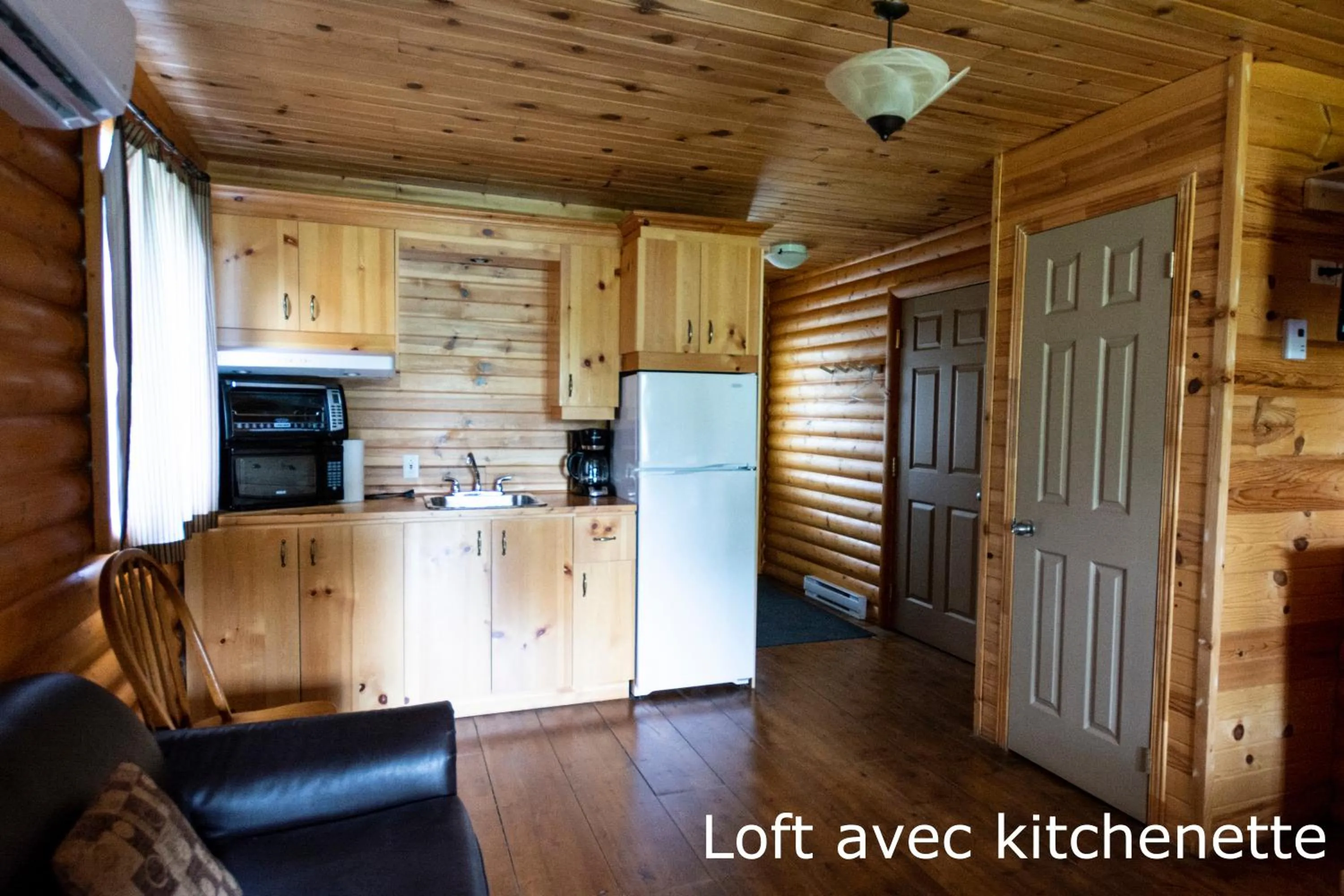 Kitchen or kitchenette in Chalets et Spa Lac Saint-Jean
