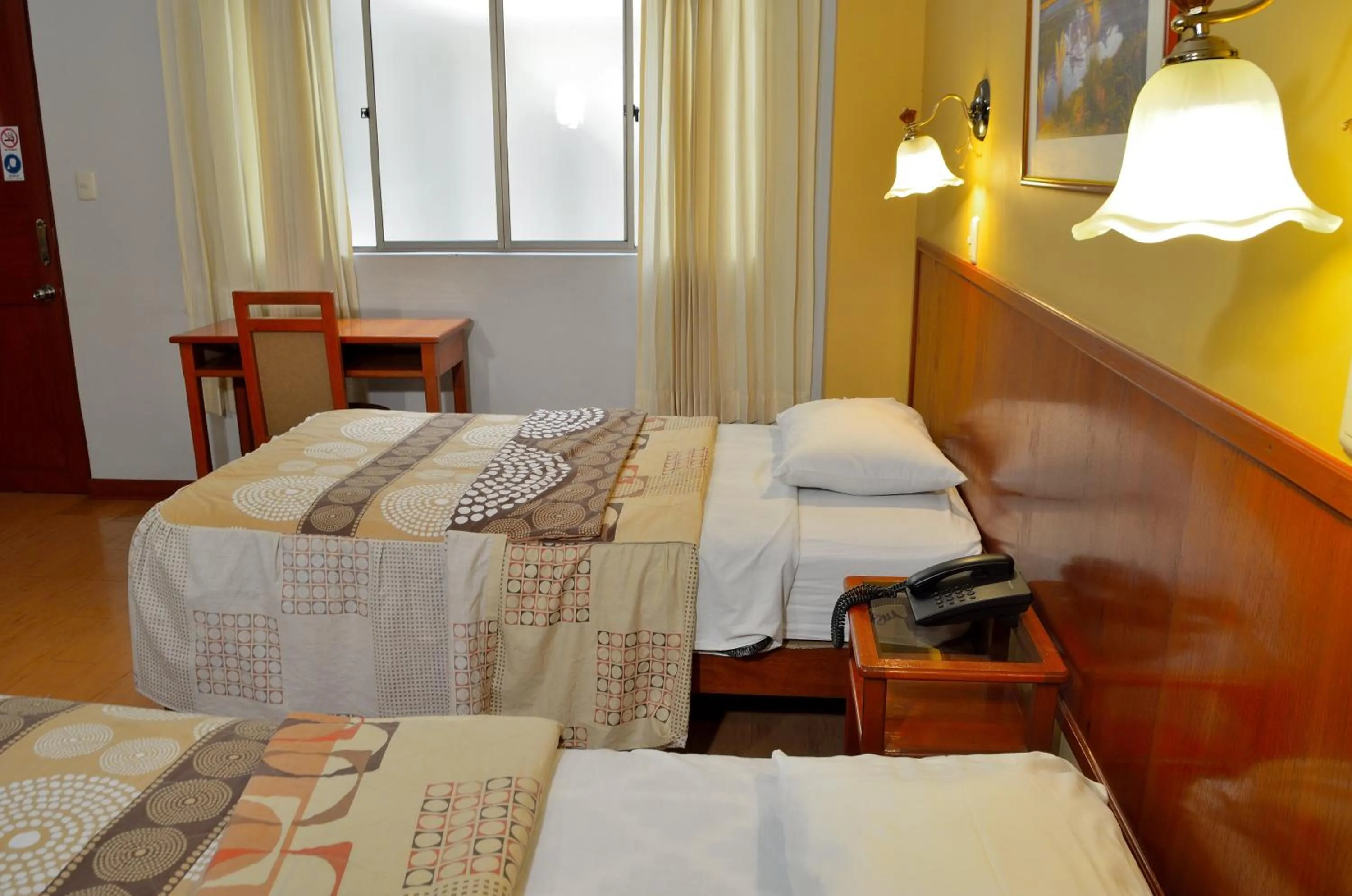 Bed in Primavera Plaza Hotel