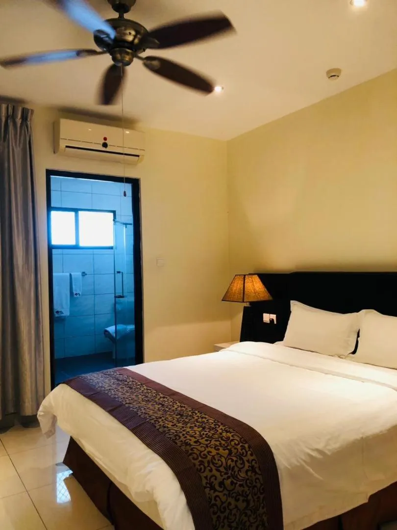 Bed in Palm Beach Hotel Dili