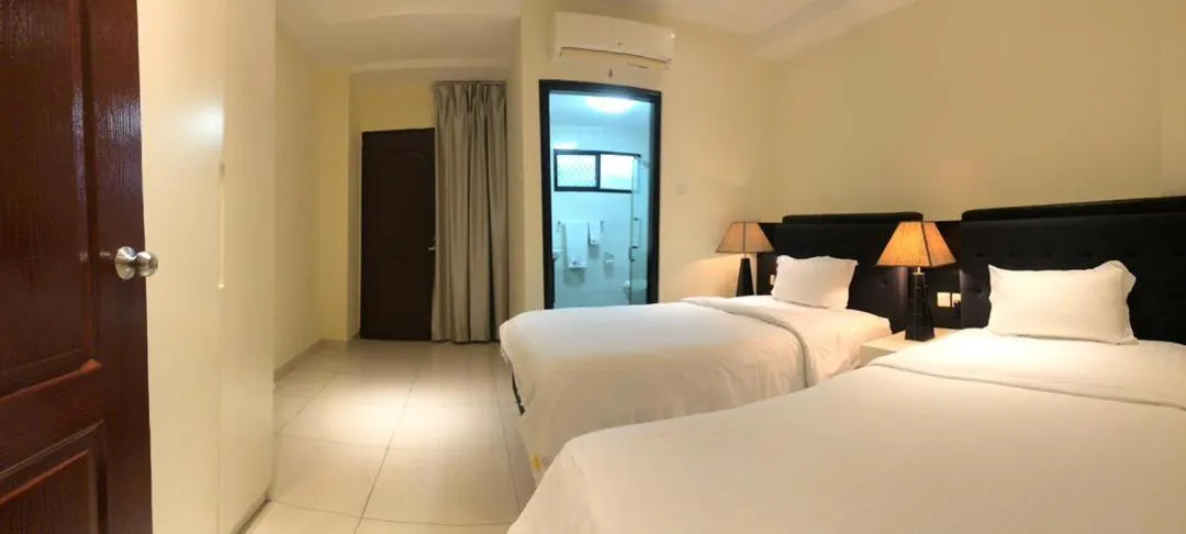 Bed in Palm Beach Hotel Dili