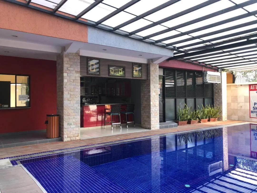 Swimming pool in Palm Beach Hotel Dili