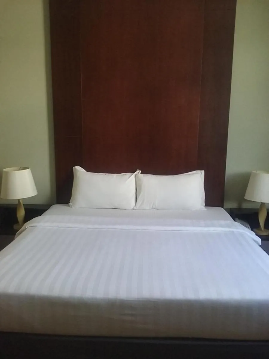 Bed in Ginasuite Hotel