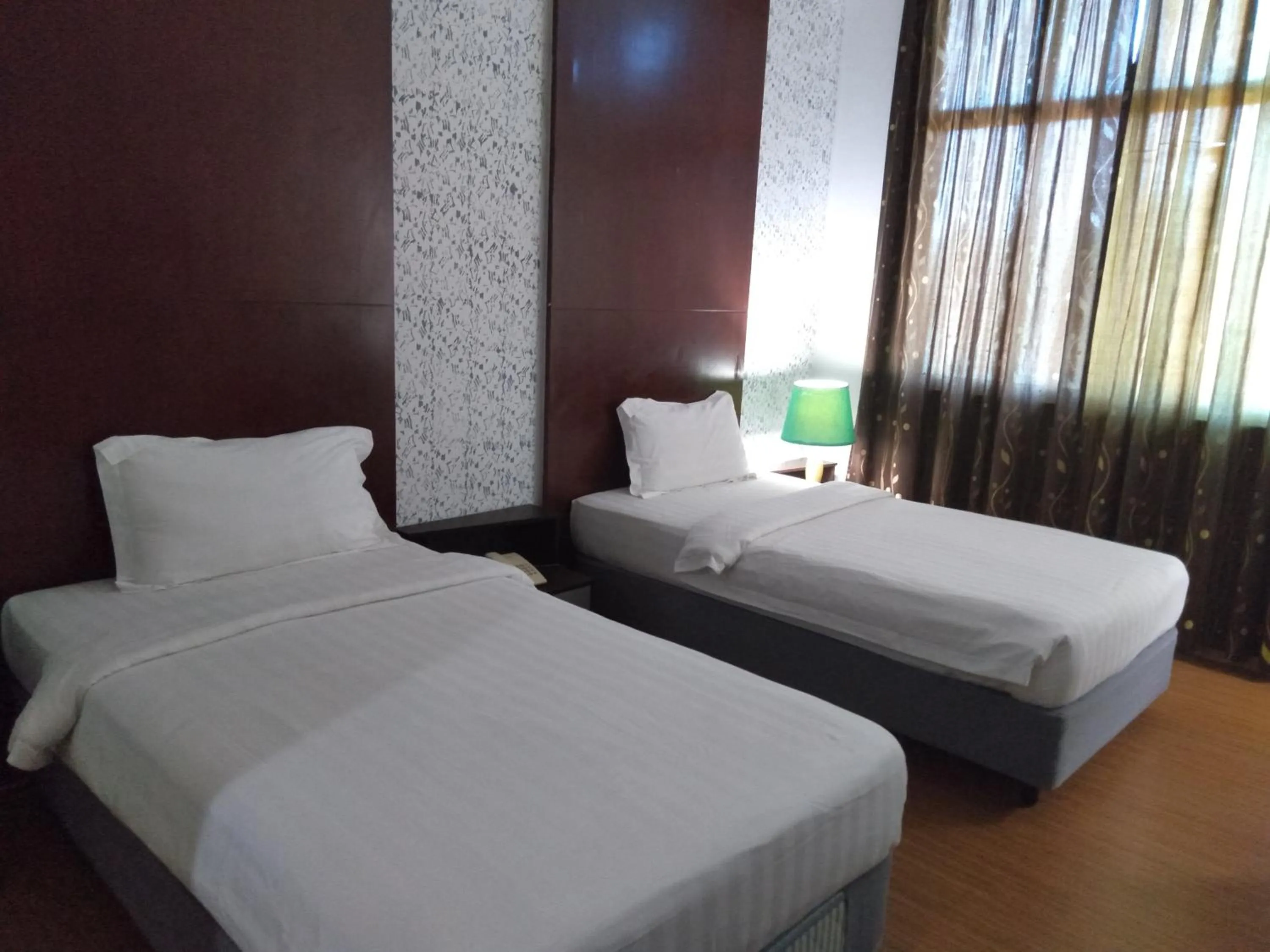 Bed in Ginasuite Hotel