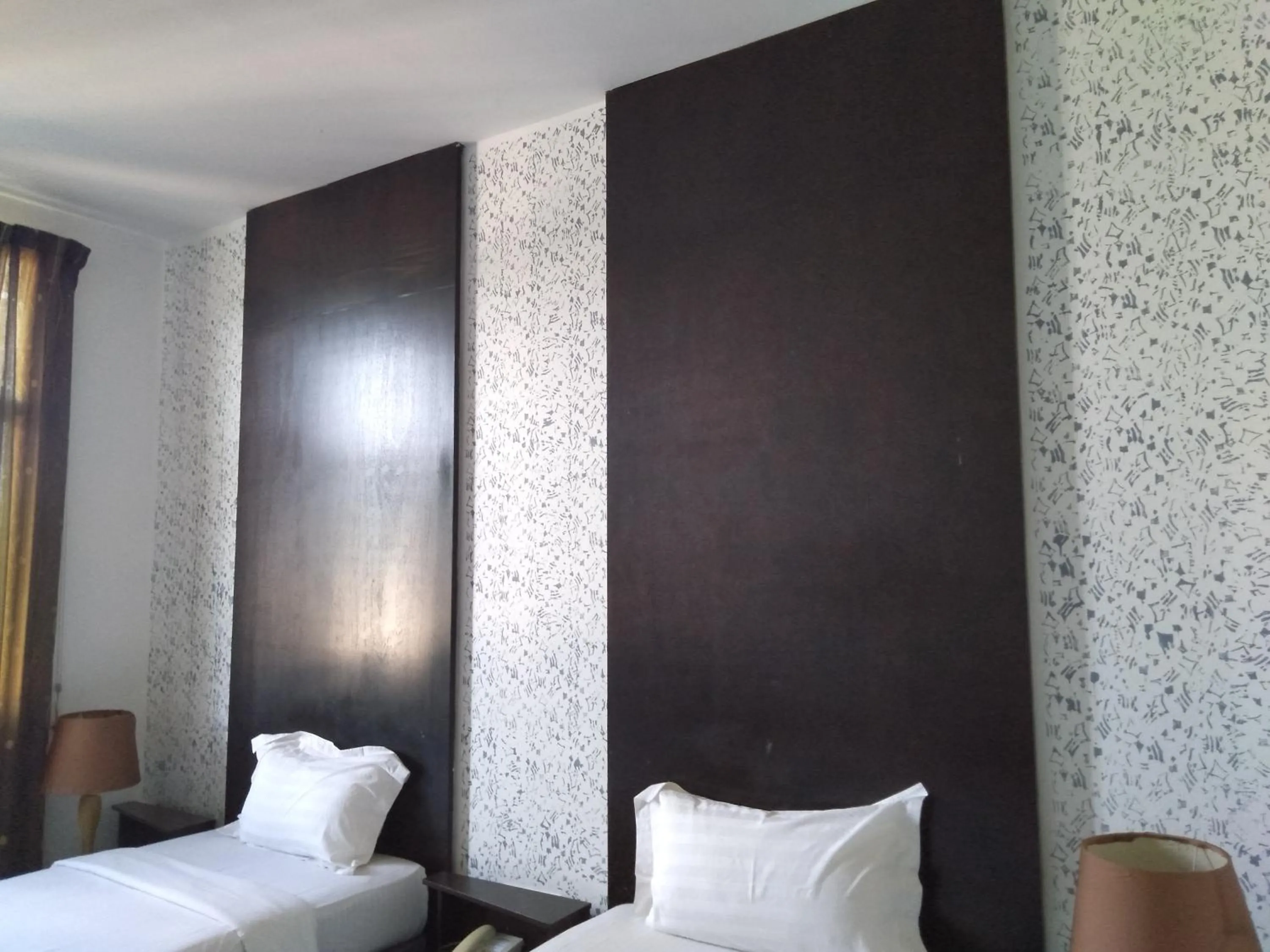 Bed in Ginasuite Hotel