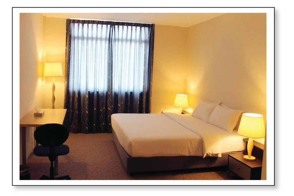 Bed in Ginasuite Hotel