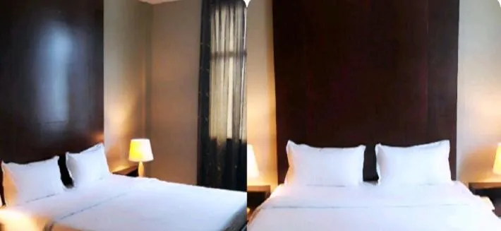 Bed in Ginasuite Hotel