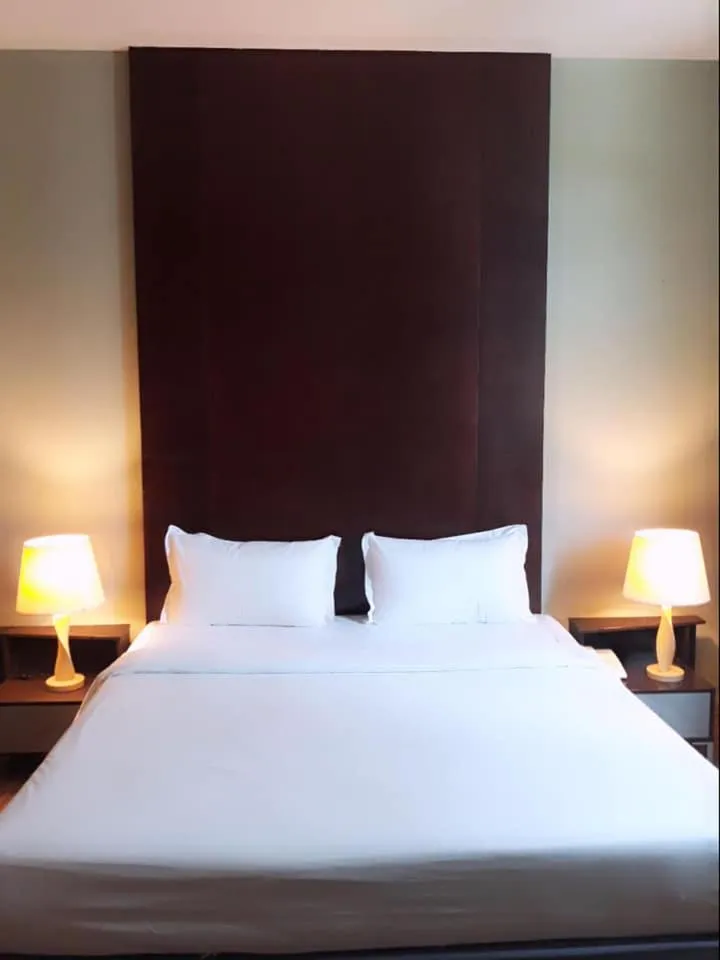 Bed in Ginasuite Hotel
