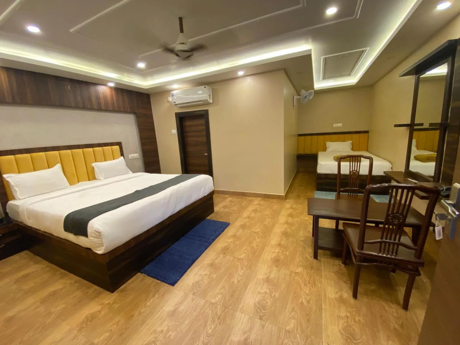 Photo of the whole room, Bed in Magizhvanam