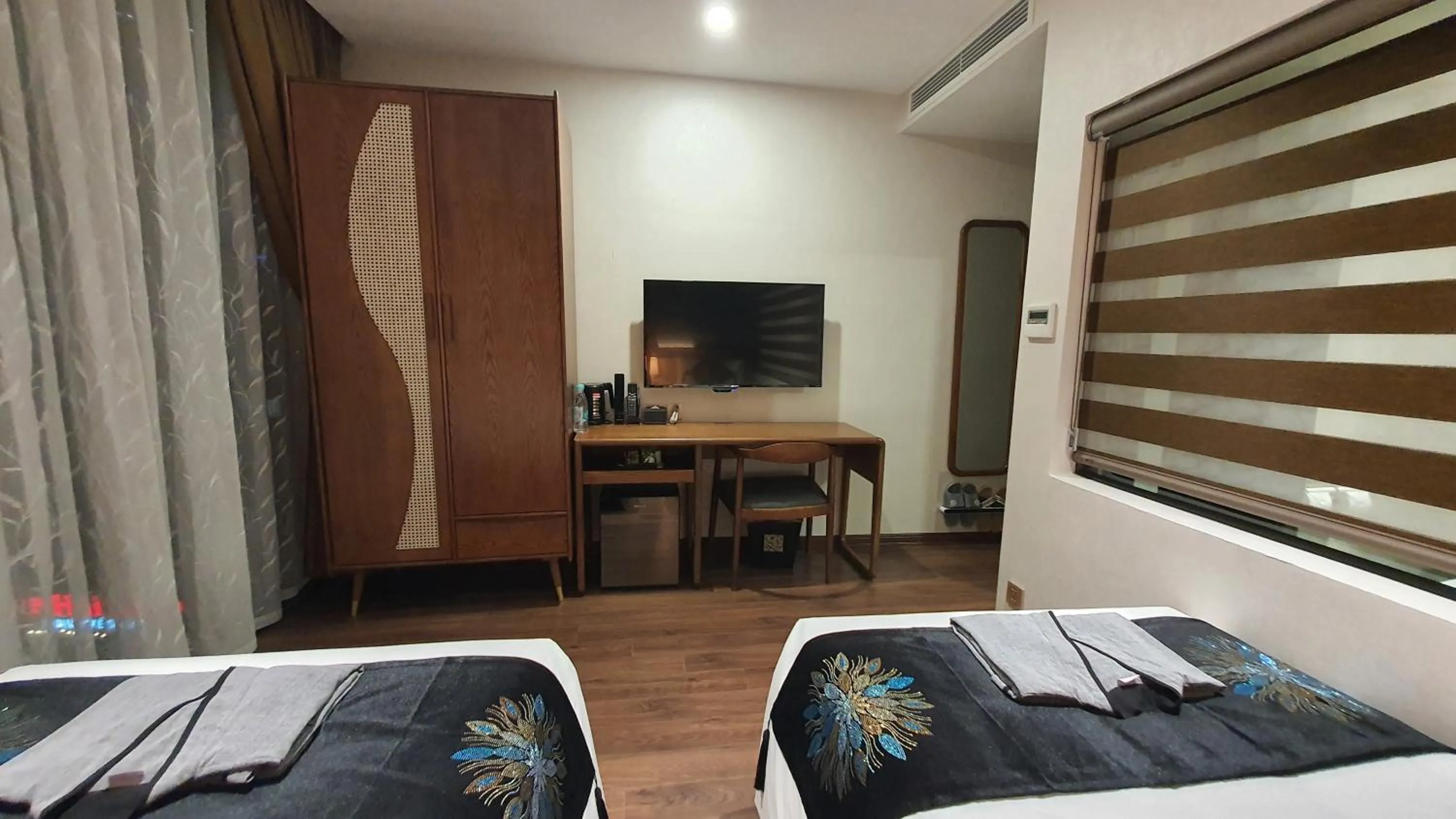 Seating area, Bed in MOMIZI HANOI 2 - PHAN KE BINH