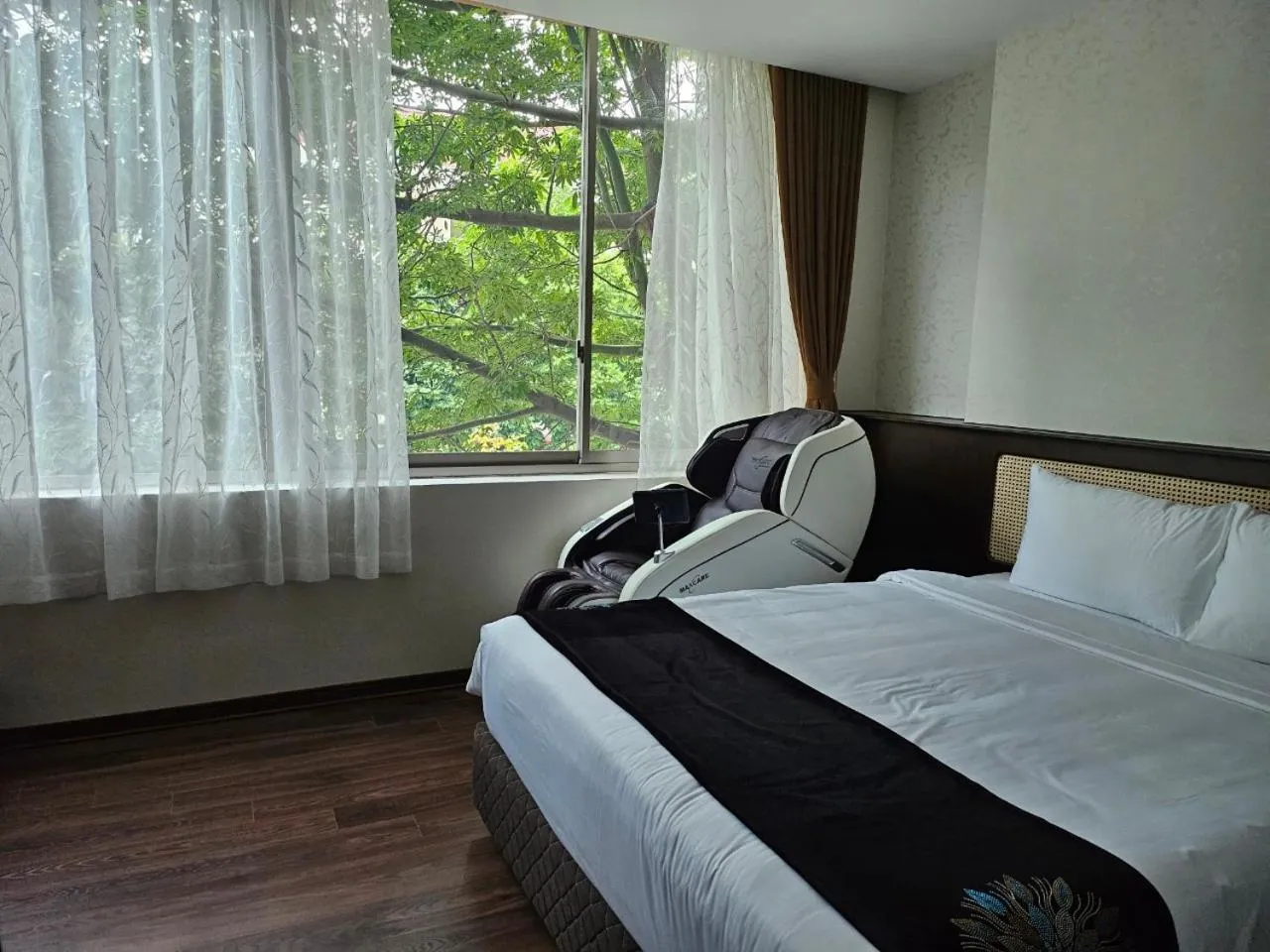 Photo of the whole room, Bed in MOMIZI HANOI 2 - PHAN KE BINH