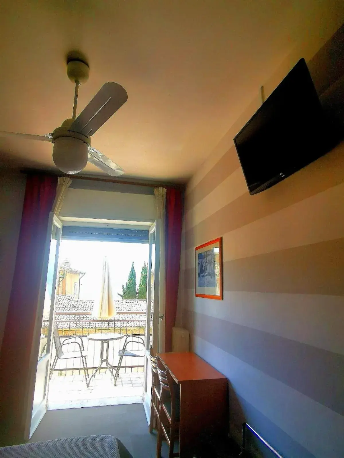 TV/Entertainment Center in Albergo Al Pescatore