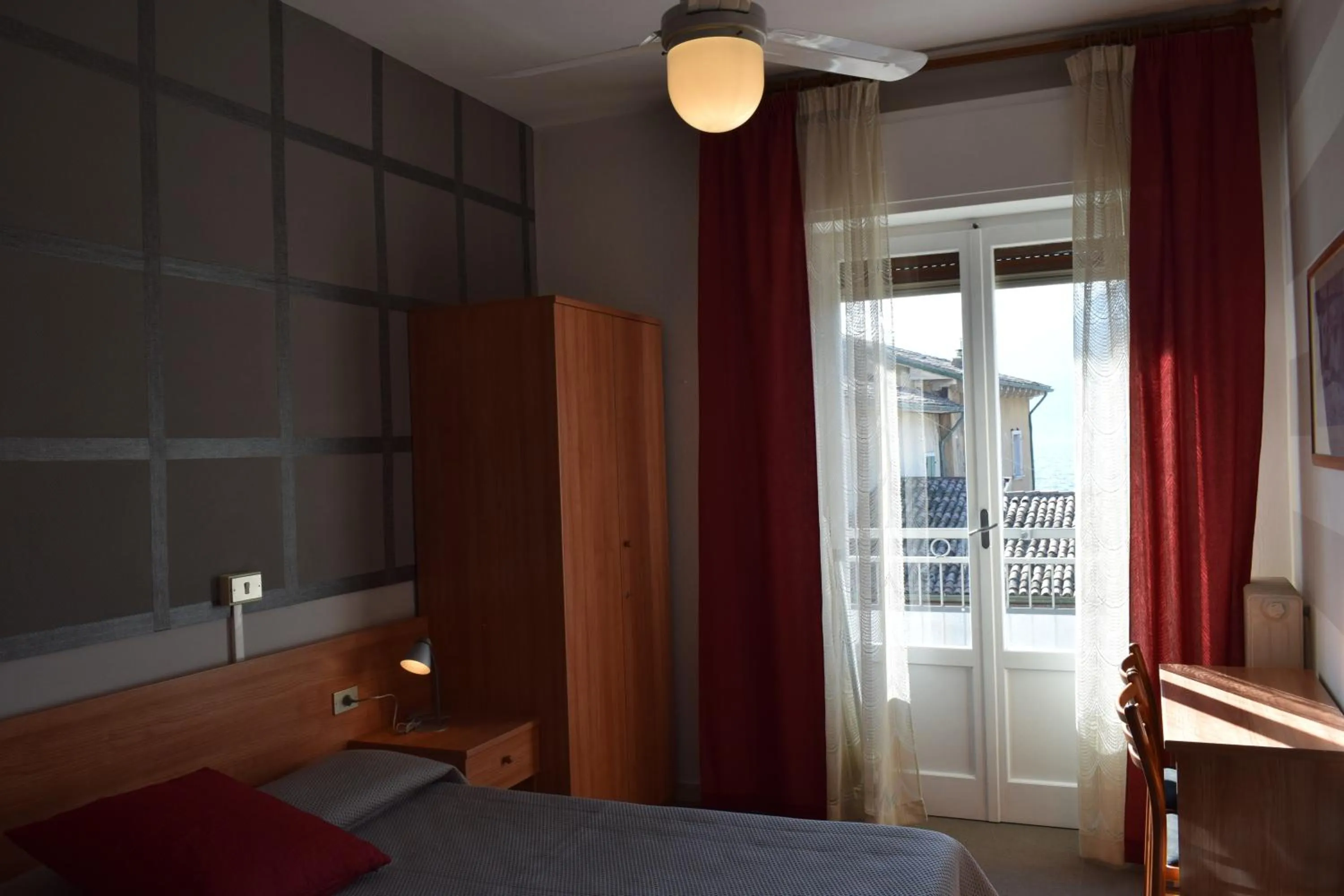 Bed in Albergo Al Pescatore