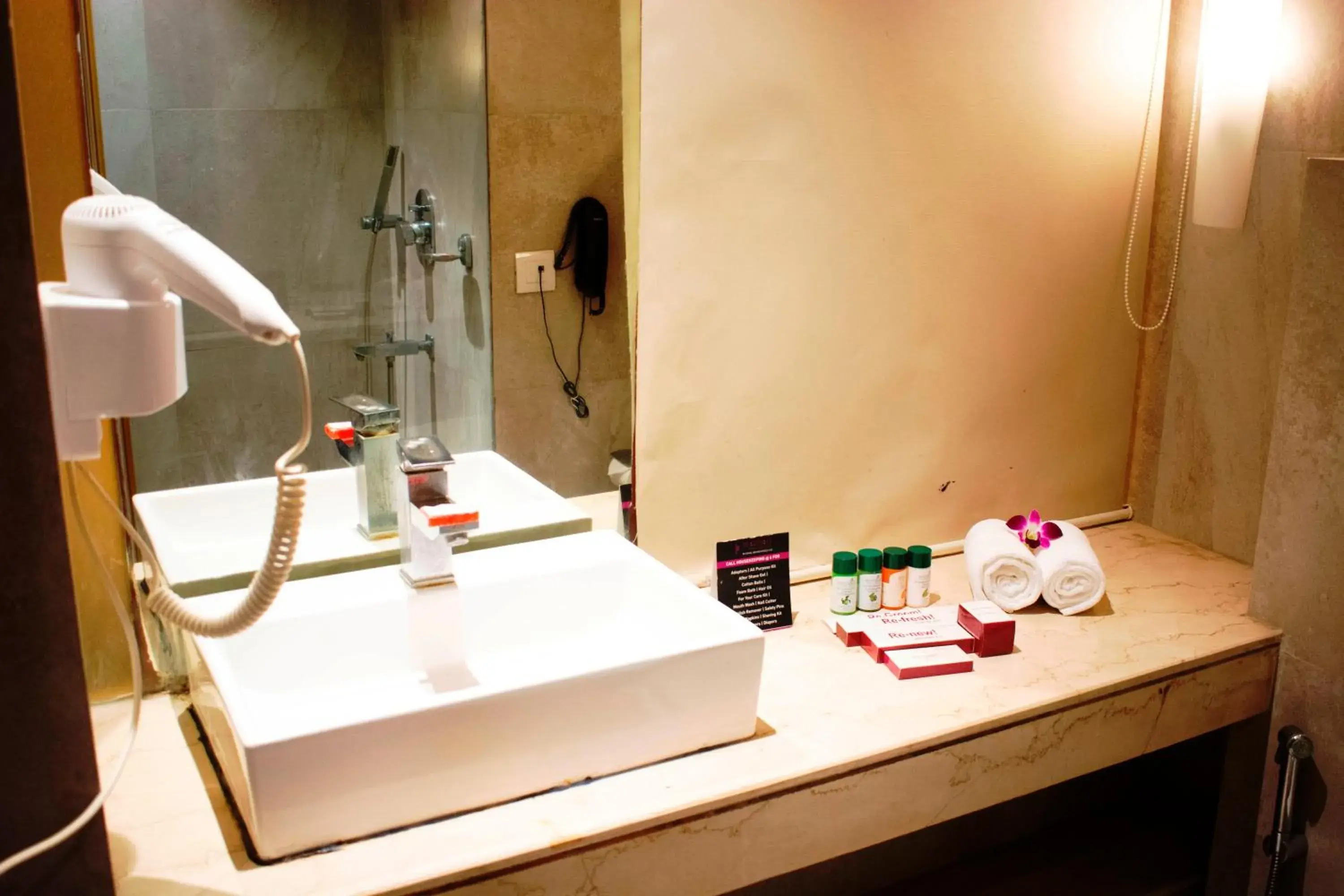 Bathroom in Regenta Orkos Kolkata by Royal Orchid Hotels Limited Bathroom in Regenta Orkos Kolkata by Royal Orchid Hotels Limited