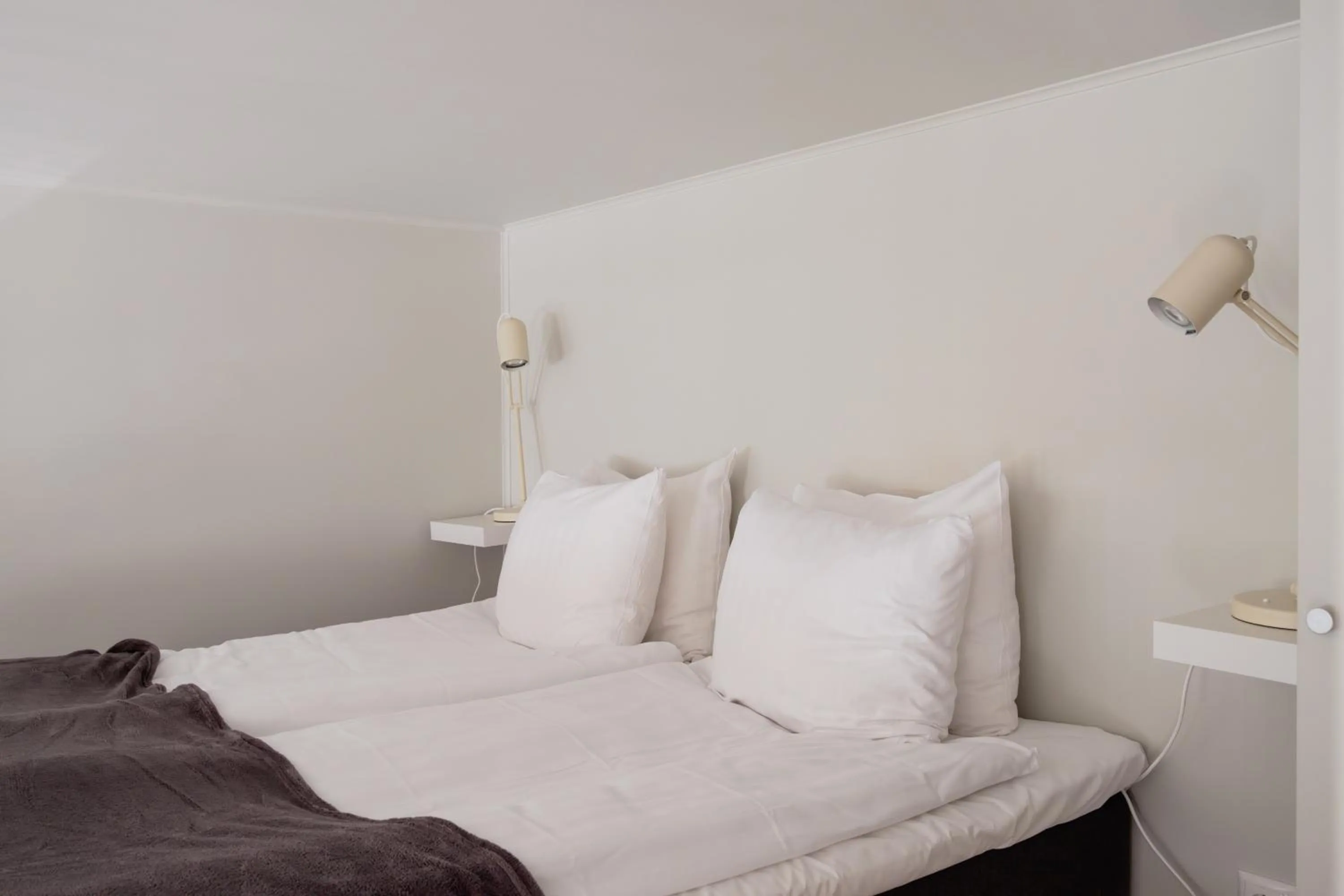 Bed in Waterfront Cabins