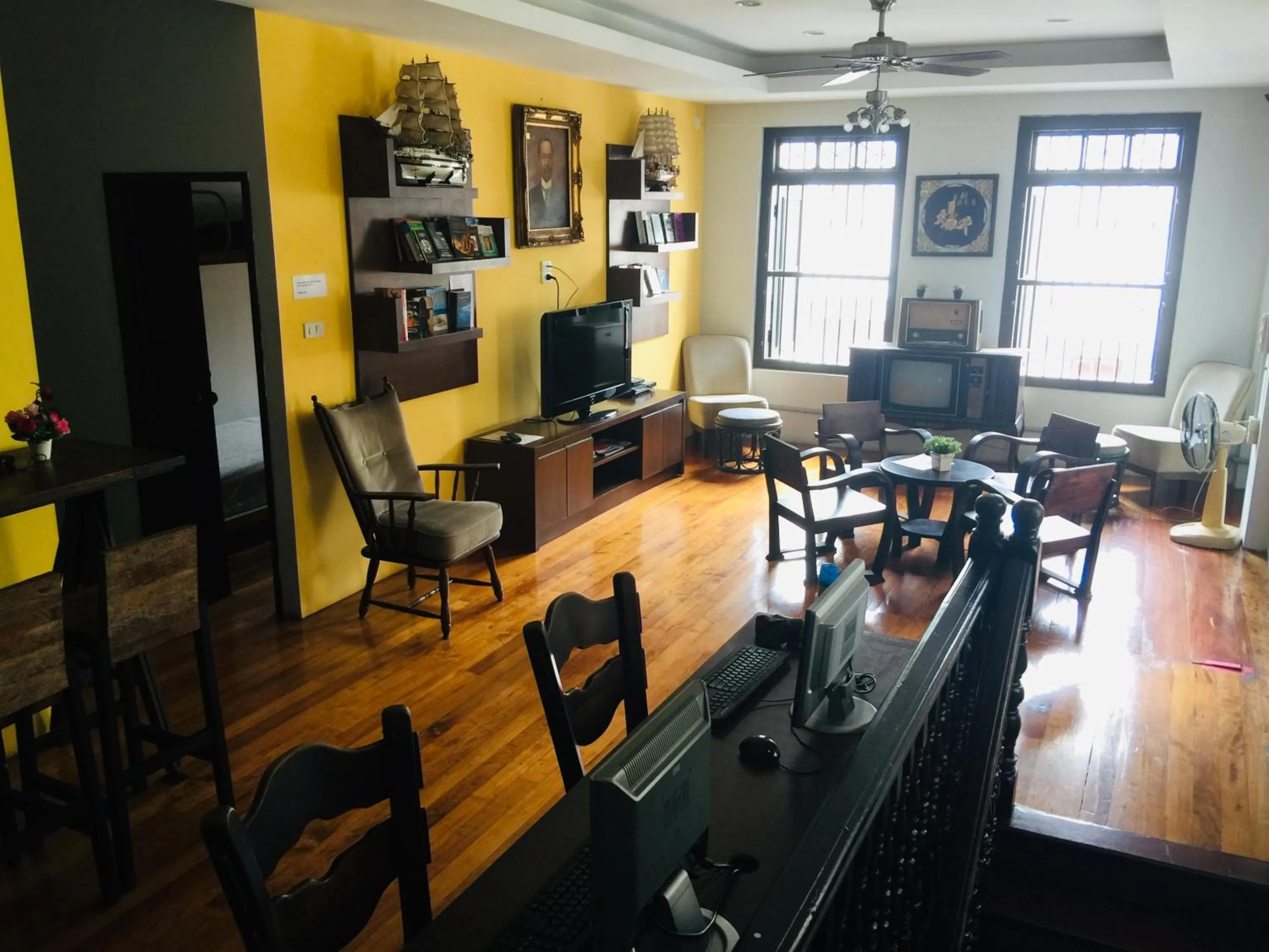 Communal lounge/ TV room in Phuket Sunny Hostel