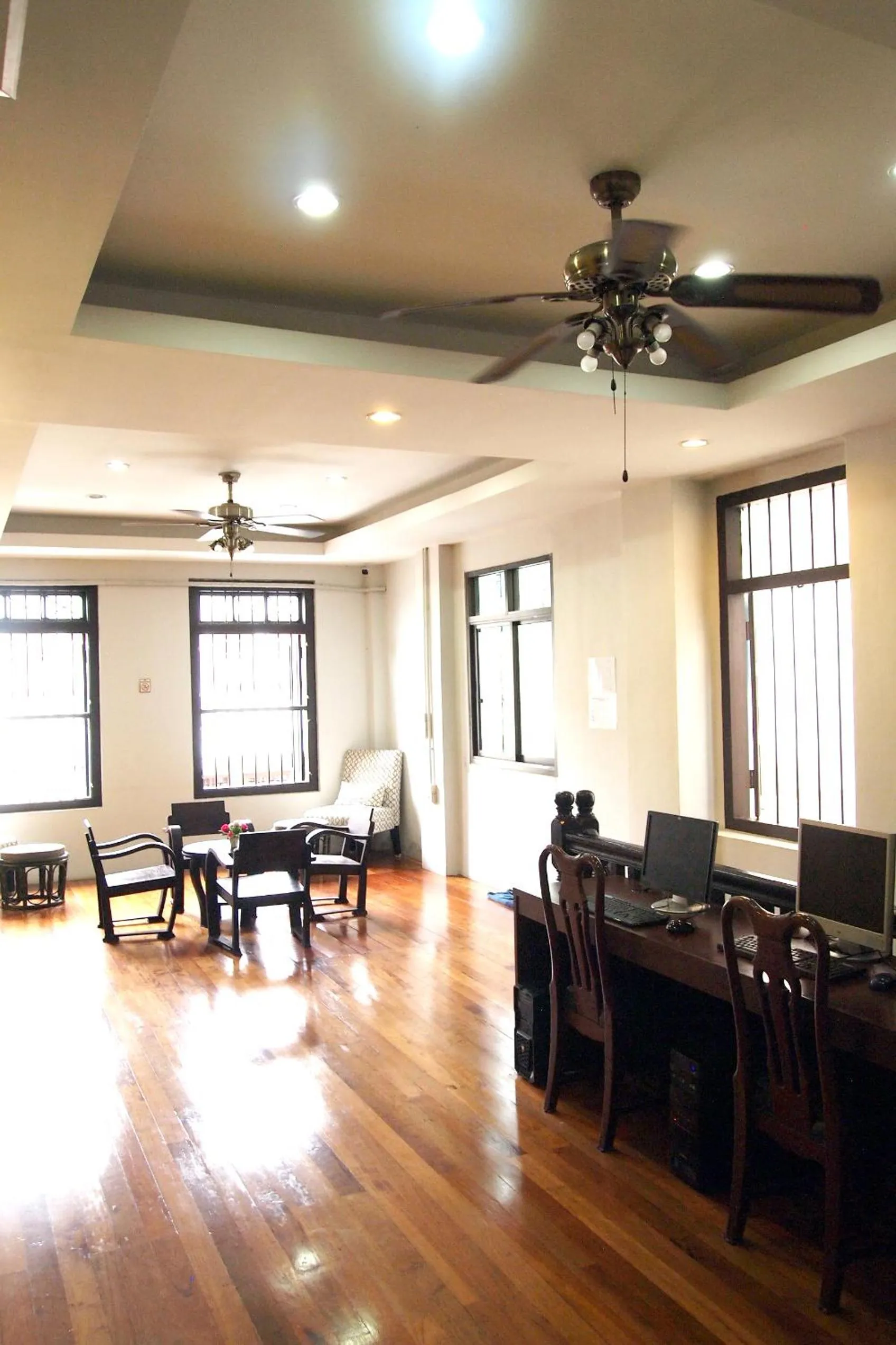 Communal lounge/ TV room in Phuket Sunny Hostel