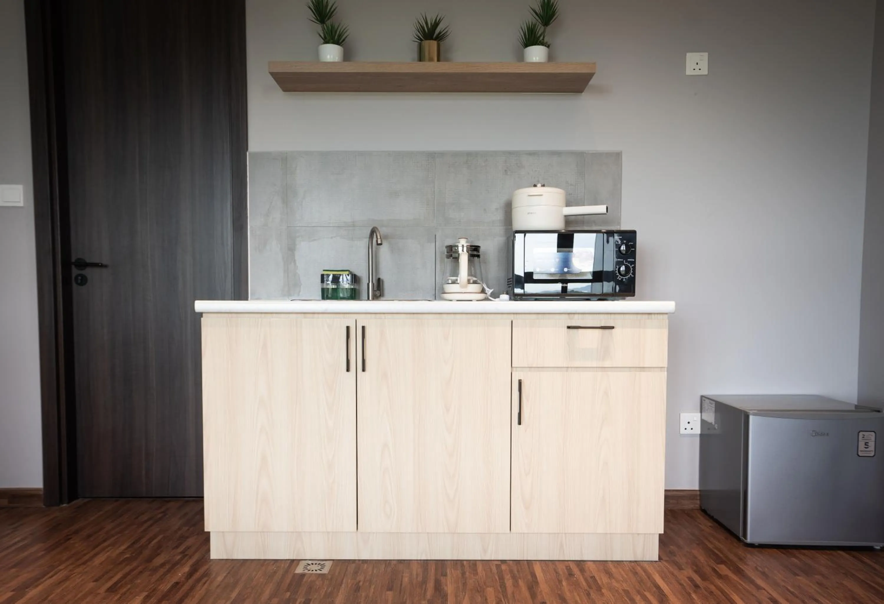 Kitchen or kitchenette in K Avenue by Pinstay