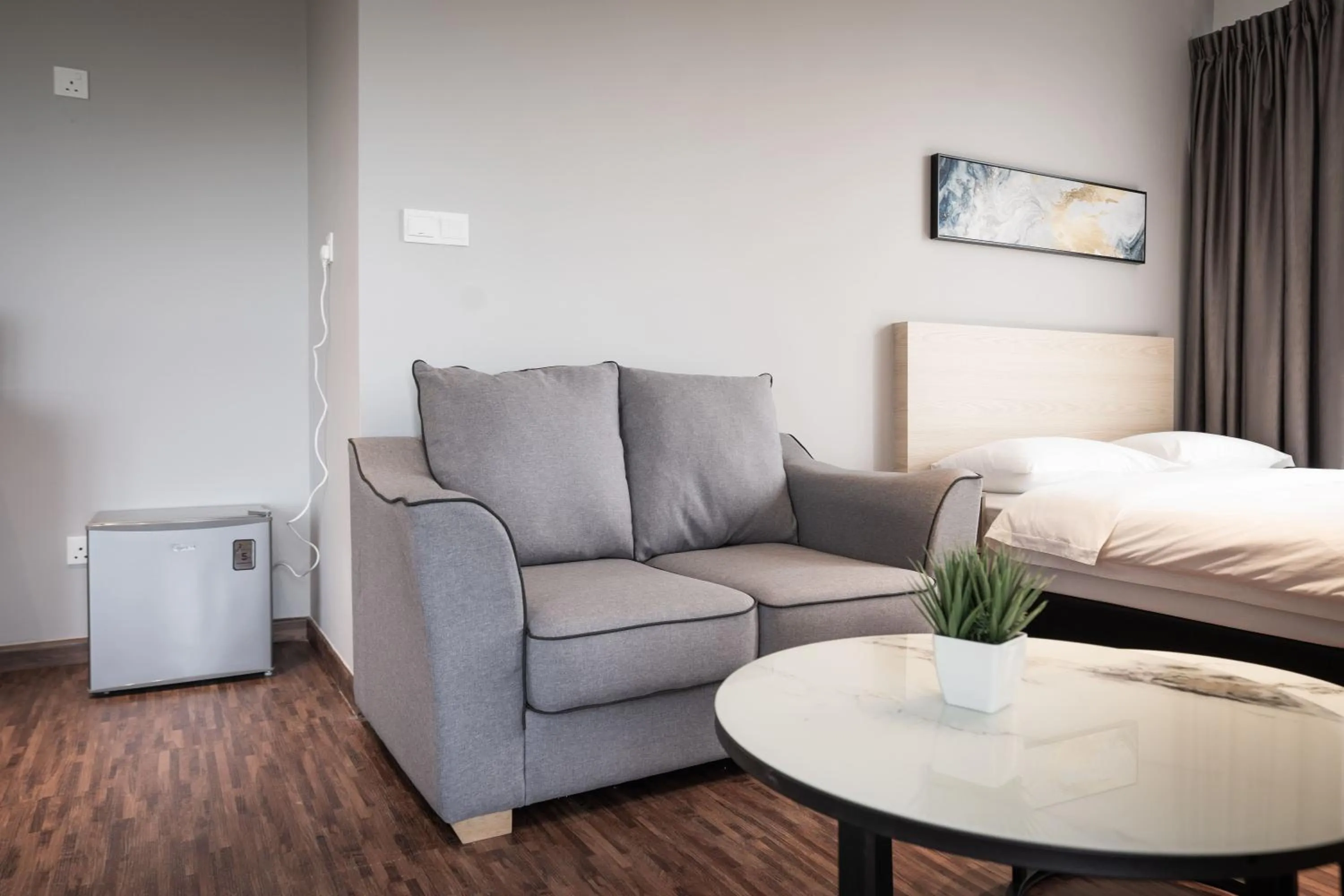 Seating area, Bed in K Avenue by Pinstay