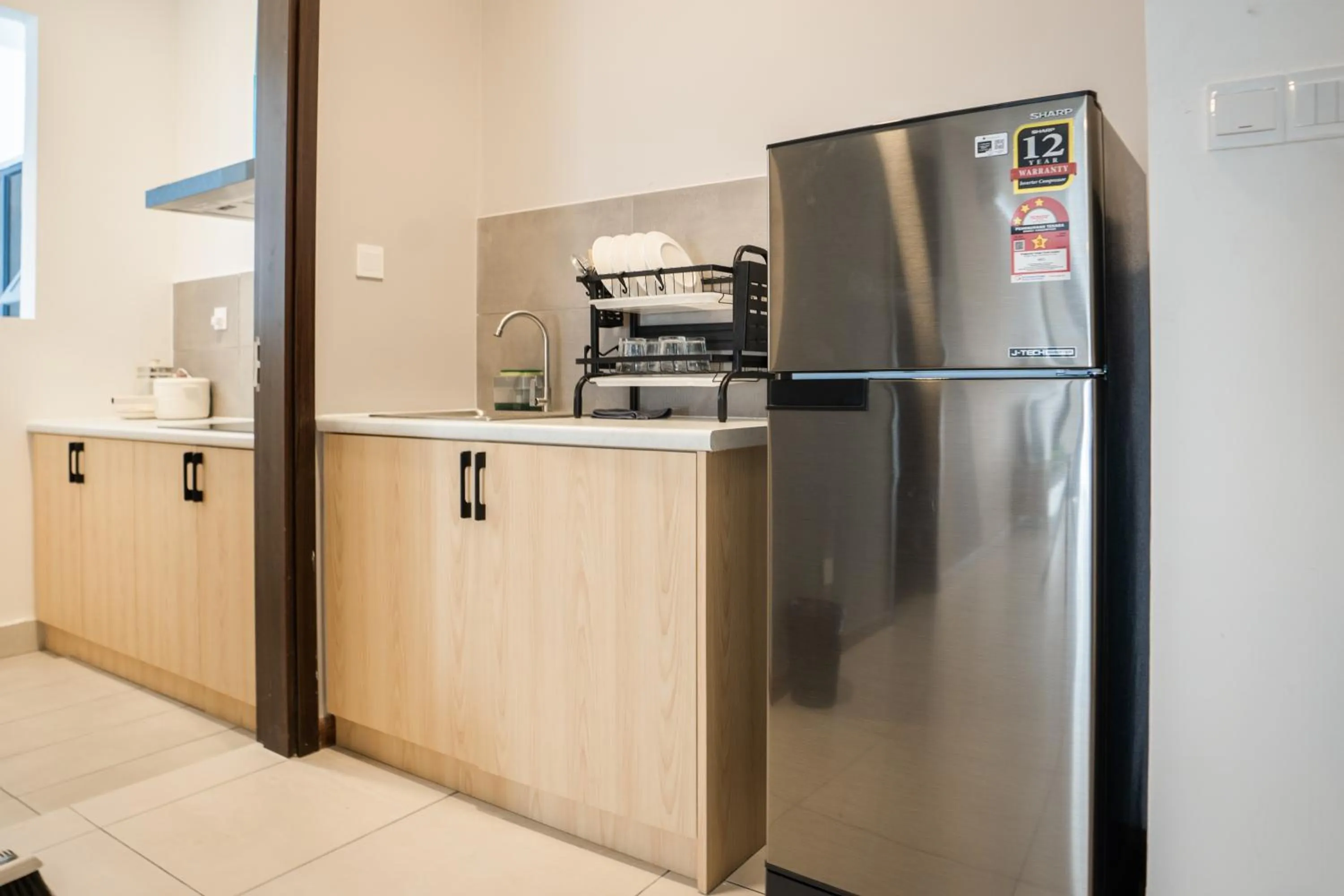 Kitchen or kitchenette in K Avenue by Pinstay