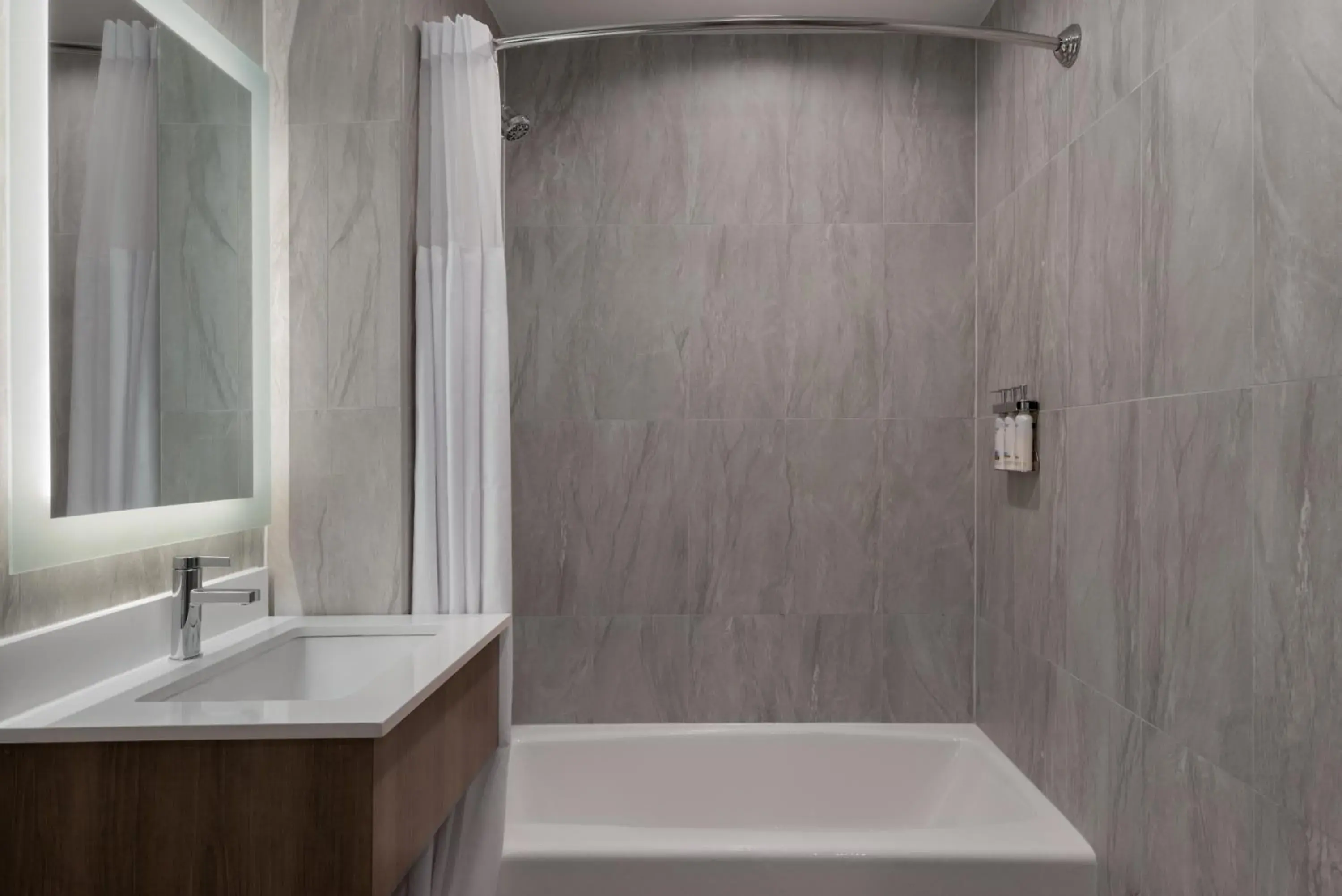 Bathroom in Holiday Inn Express & Suites Bronx - Zoo Area by IHG Bathroom in Holiday Inn Express & Suites Bronx - Zoo Area by IHG