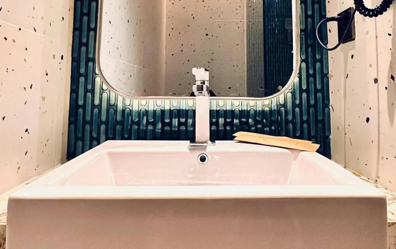 Bathroom in Qube Hotel by 98hospitality