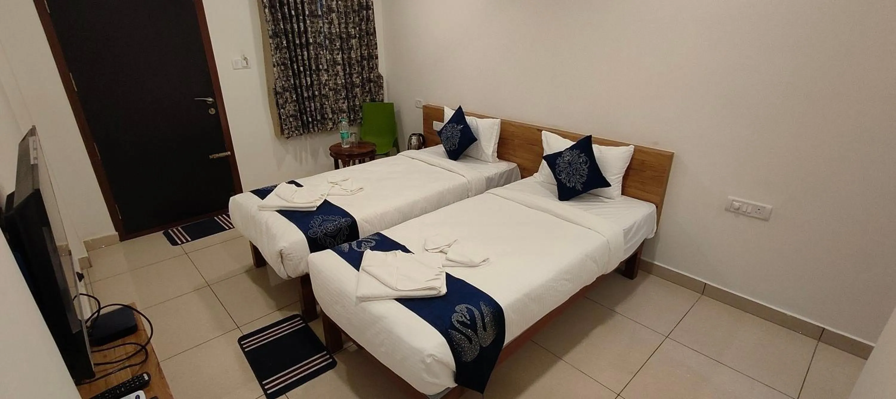 Bed in Hotel Amulya Regency