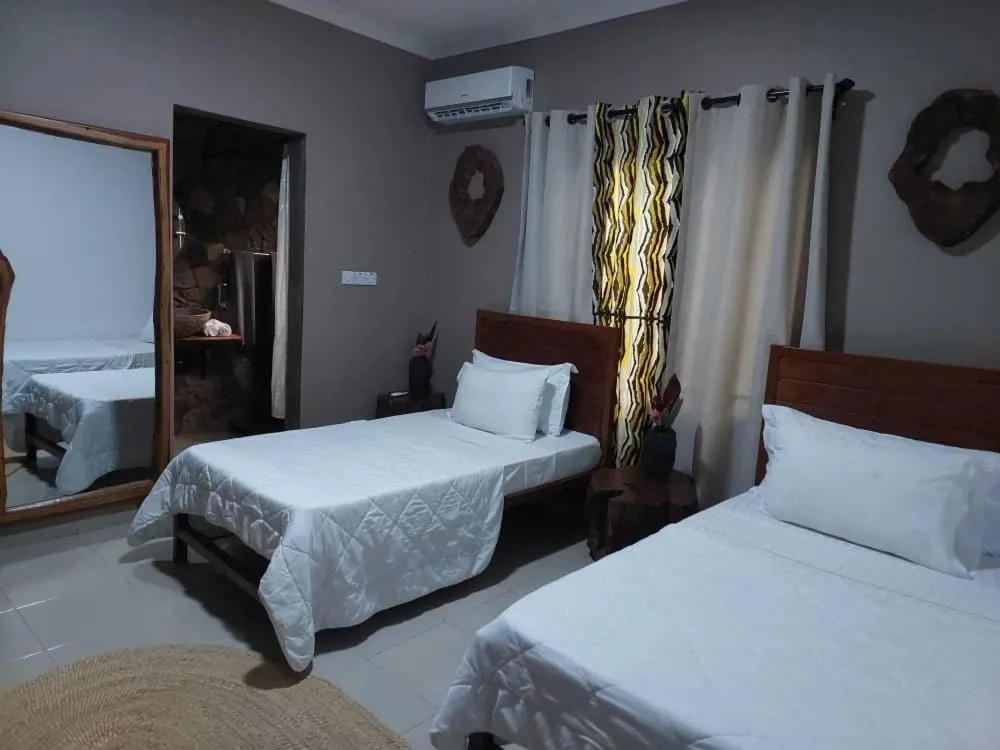 Bed in Tulivu Kilimanjaro Retreat