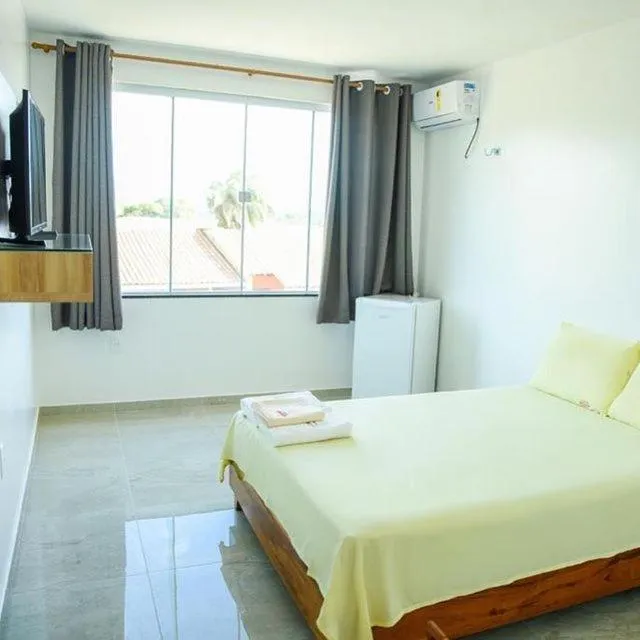 Bed in Pousada Diamante