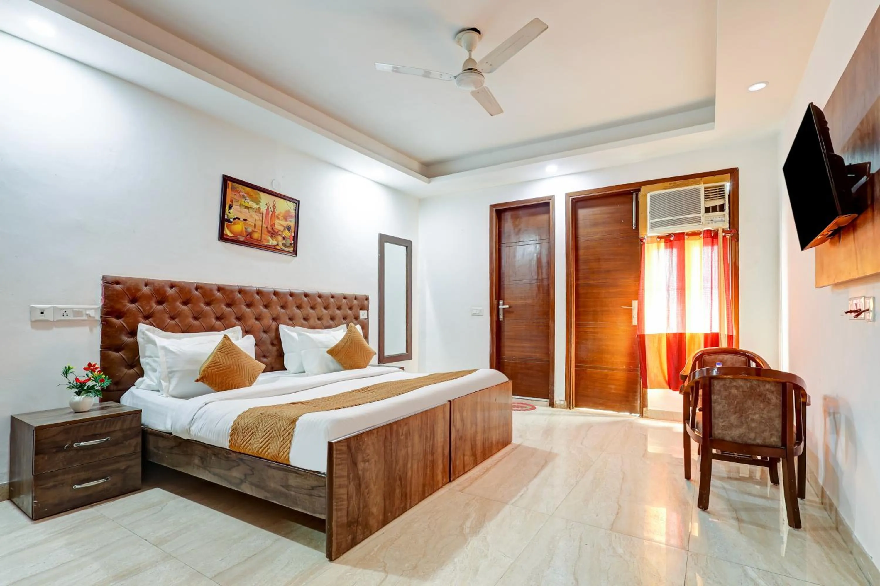 Photo of the whole room, Bed in Mauryan Elite Hotel Qutab Minar Metro Station