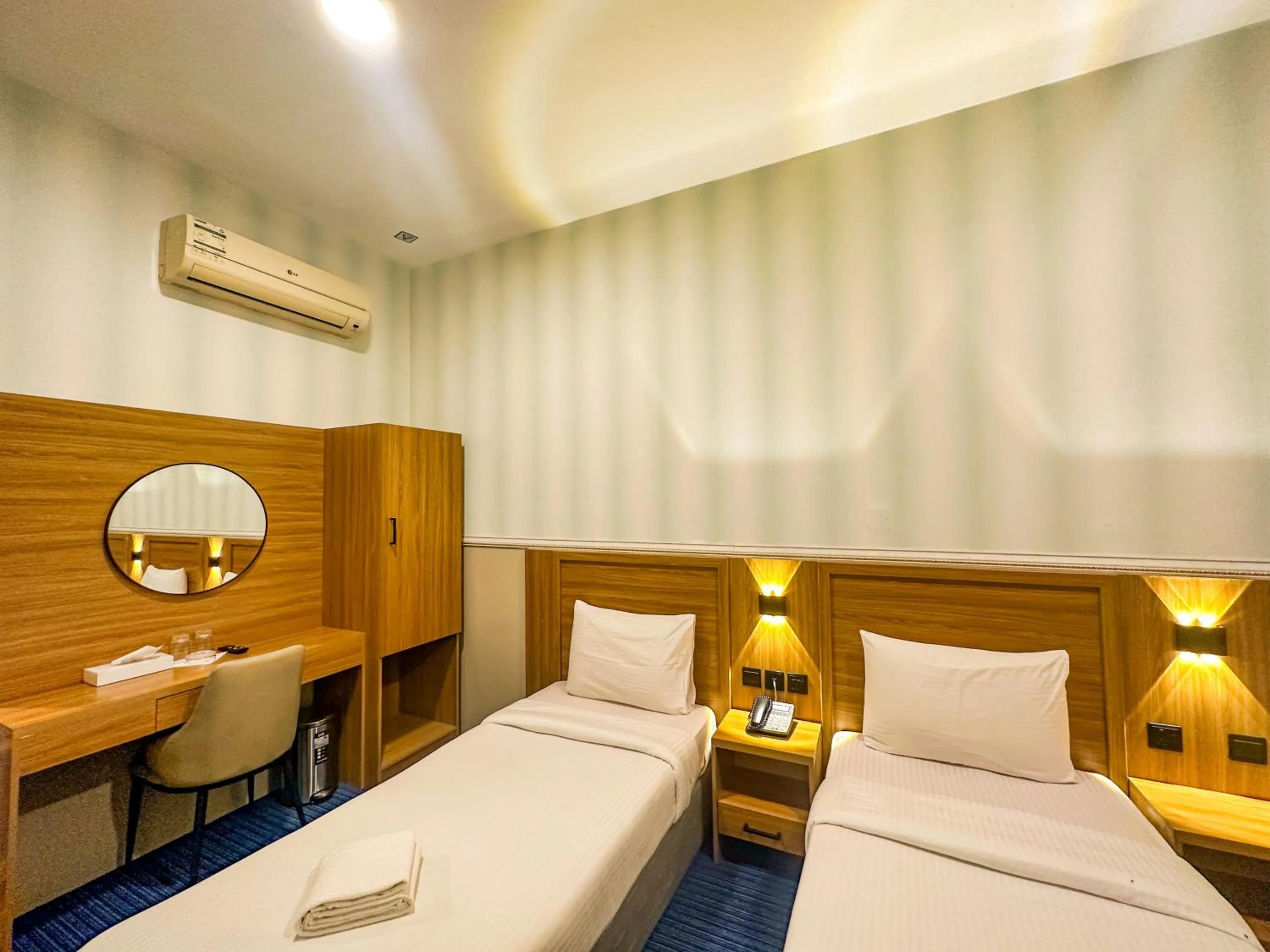 Bed in TAMARIND HOTEL