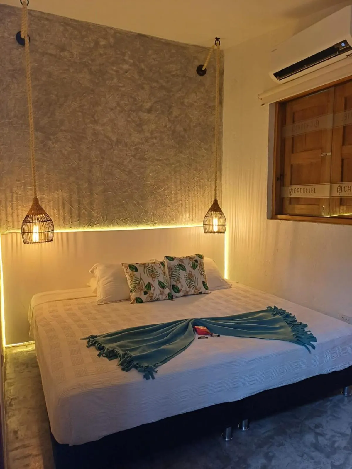 Bed in Cannatel Exclusive Hotel