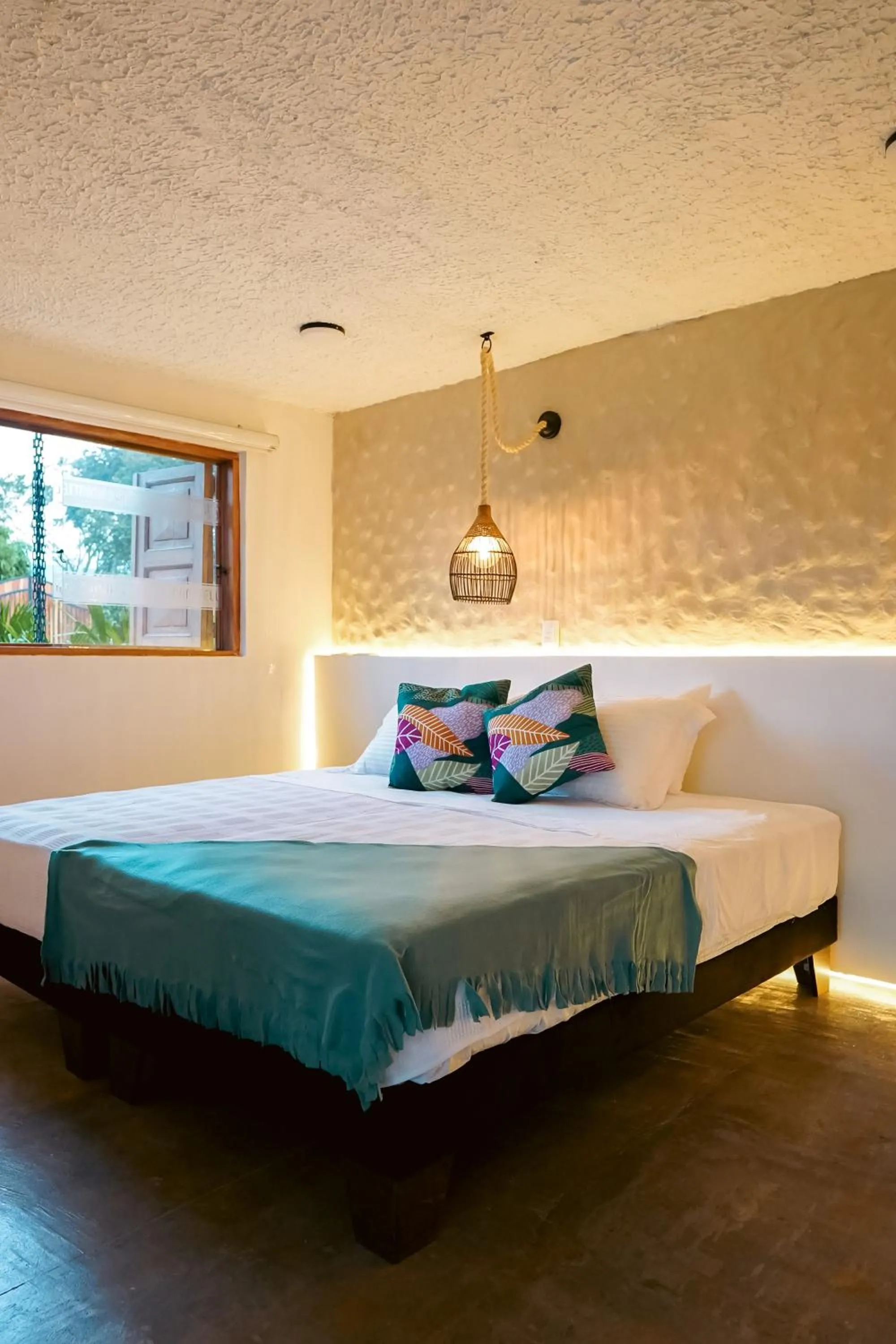 Bed in Cannatel Exclusive Hotel