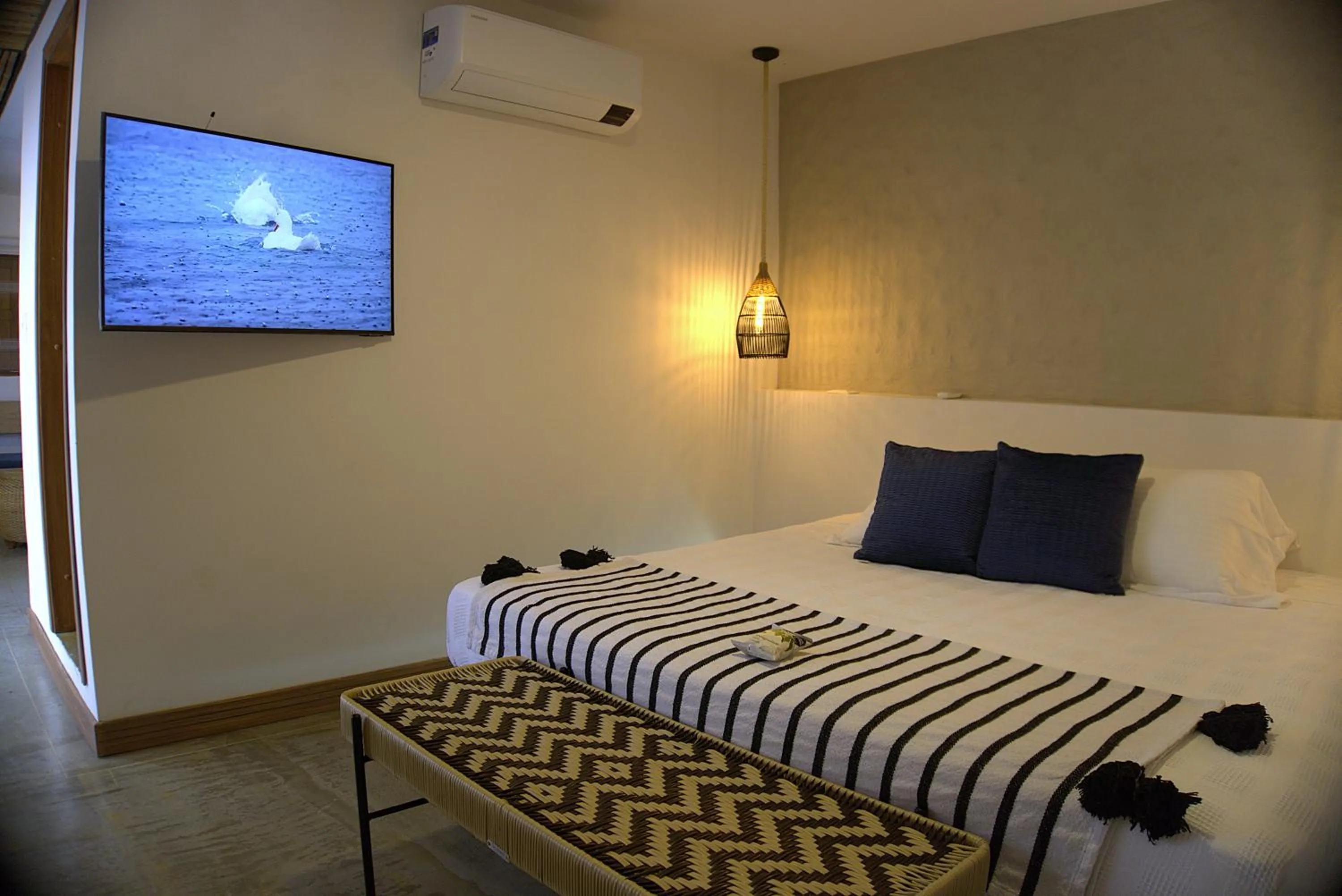 Bed in Cannatel Exclusive Hotel