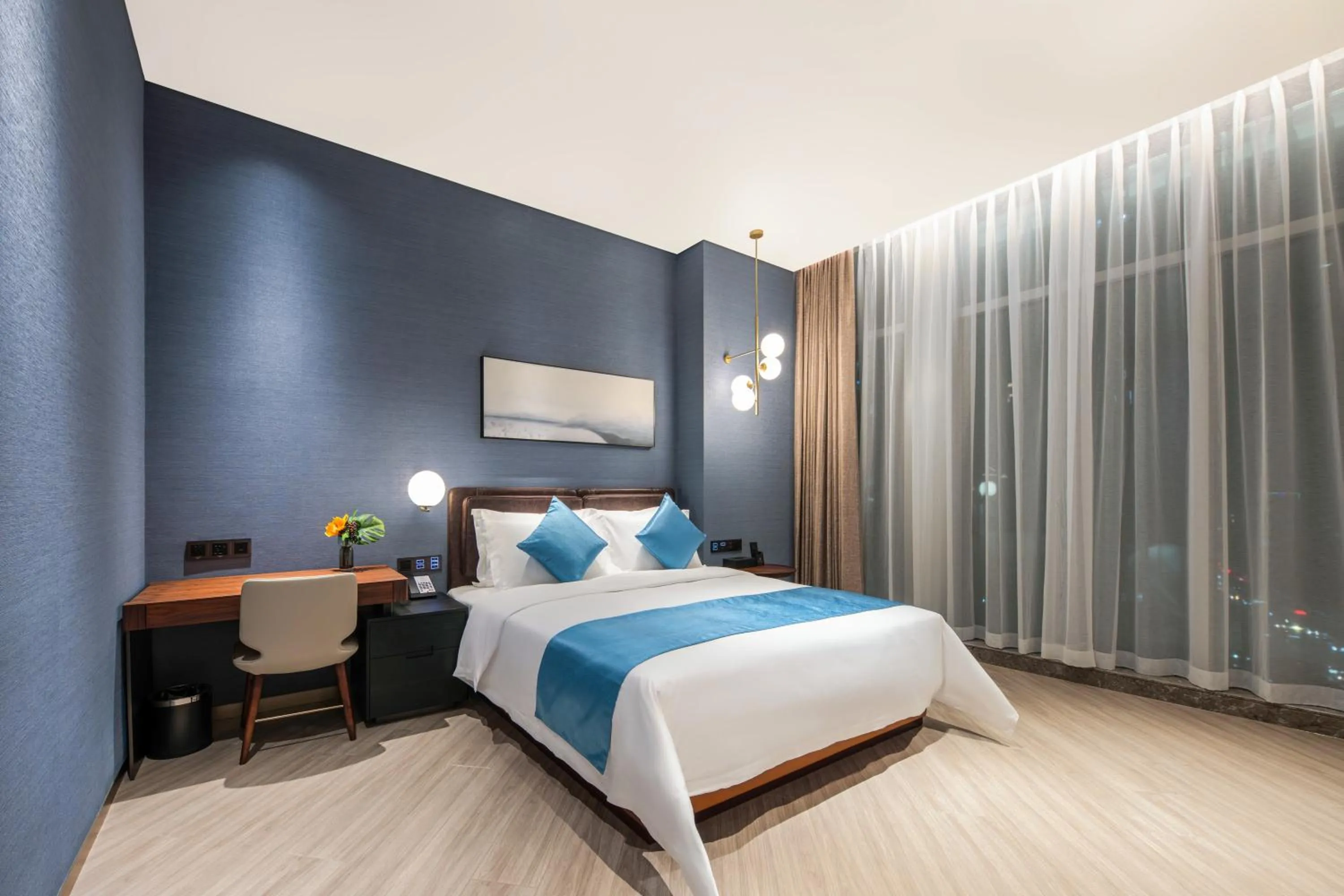 Bed in Shan Zhi Ye Serviced Apartment Hotel - Houjie Wanda Plaza Liaoxia Subway Station