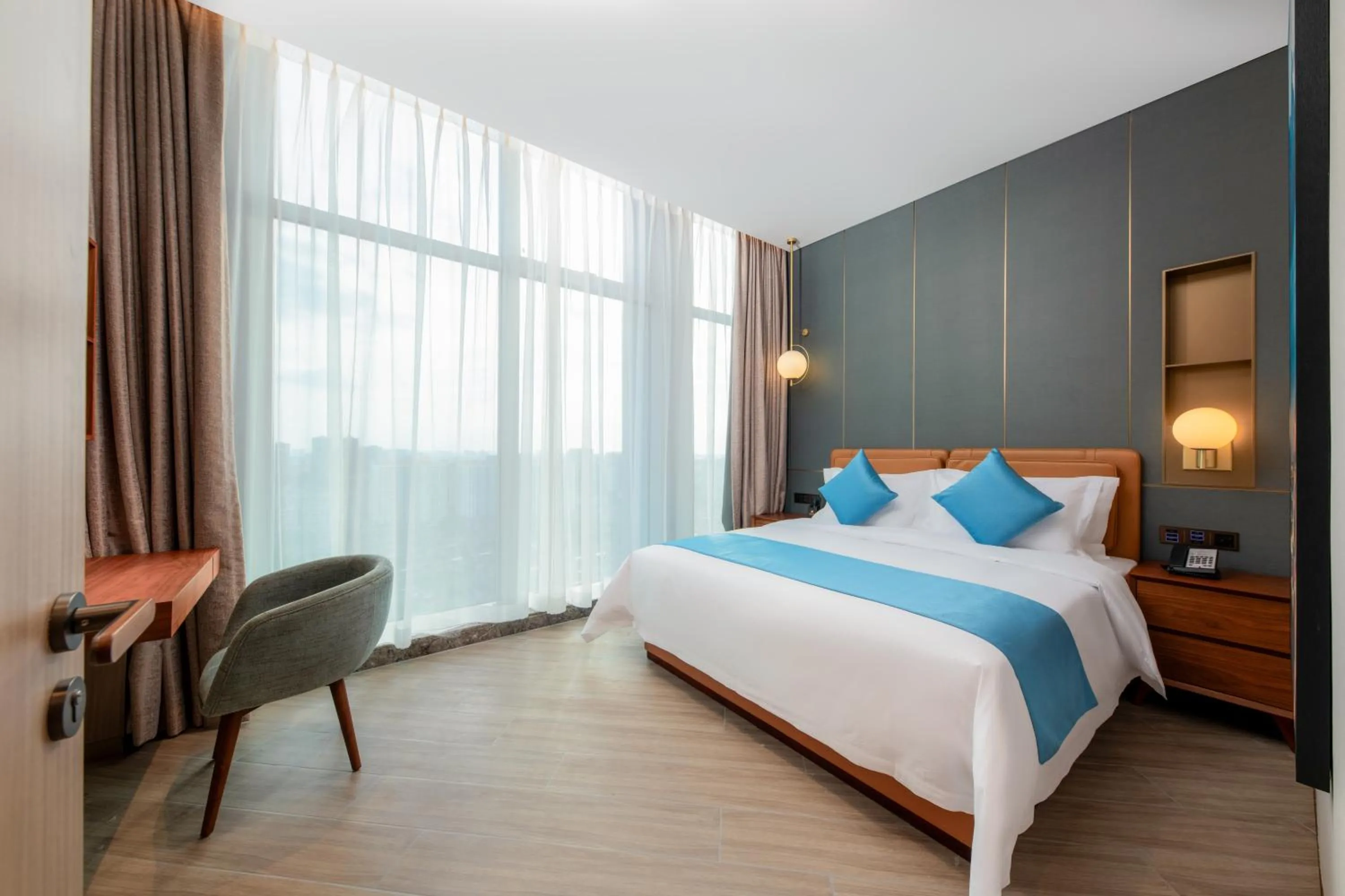 Bed in Shan Zhi Ye Serviced Apartment Hotel - Houjie Wanda Plaza Liaoxia Subway Station