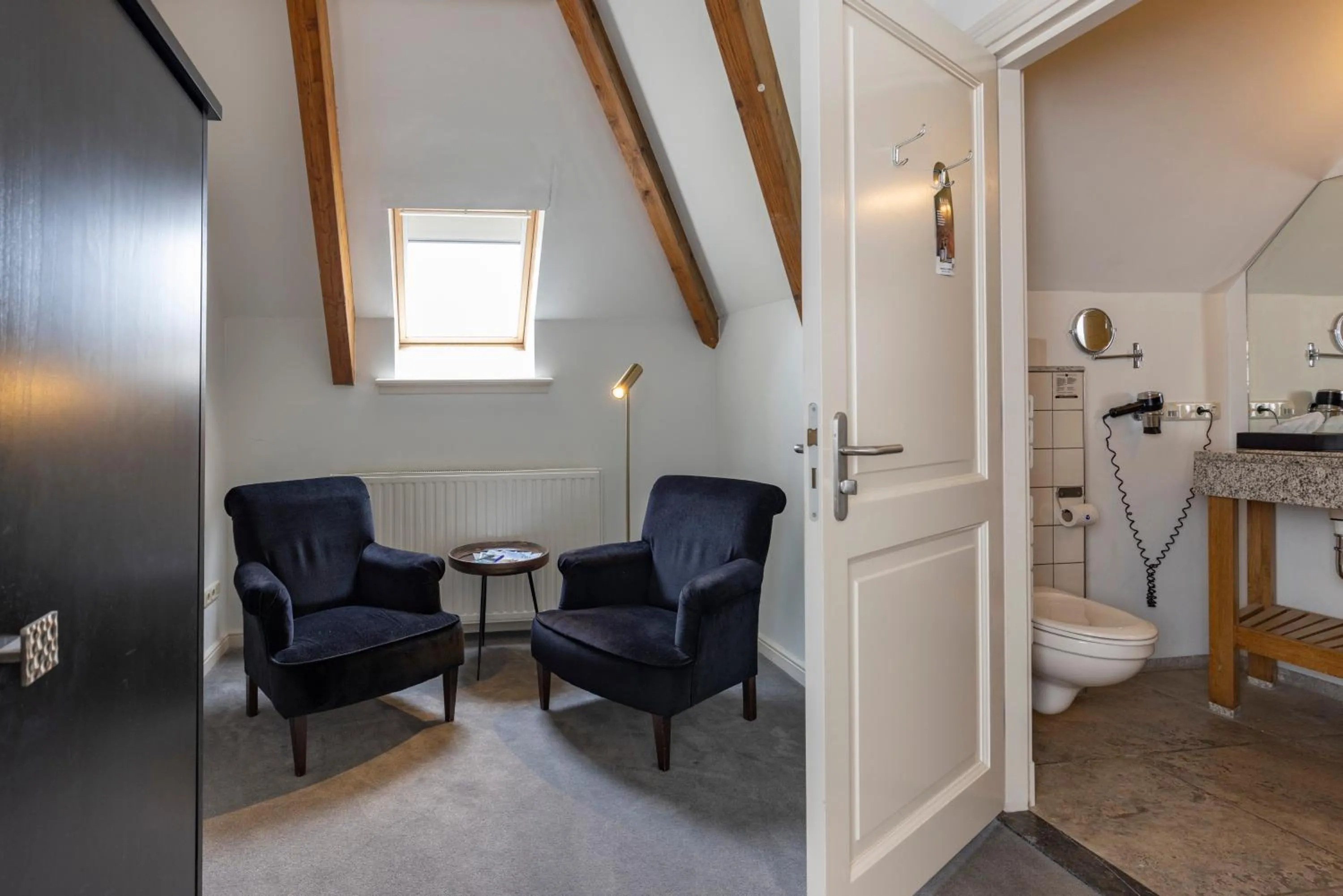 Seating area in Fletcher Hotel Château De Raay