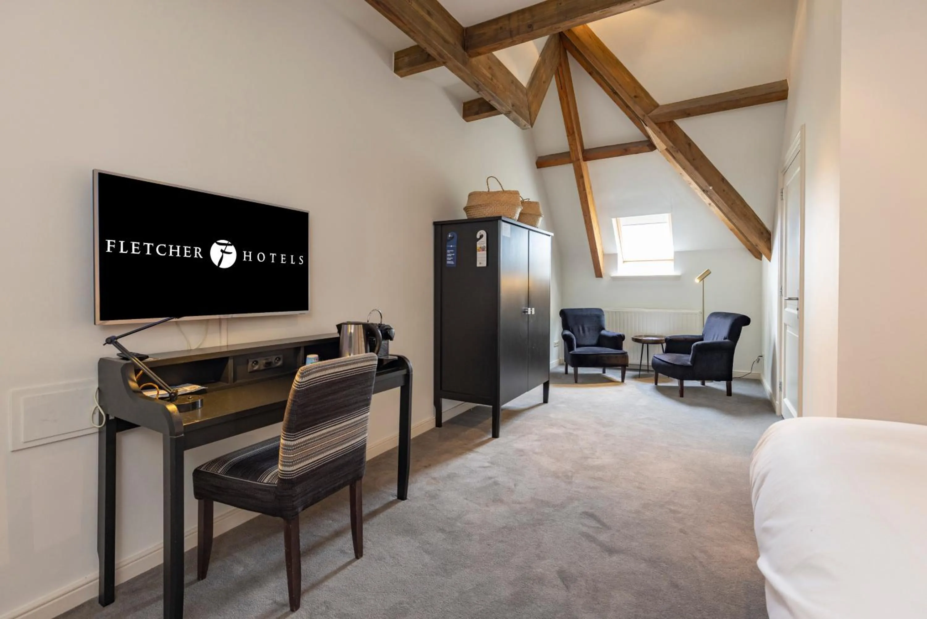 Seating area in Fletcher Hotel Château De Raay