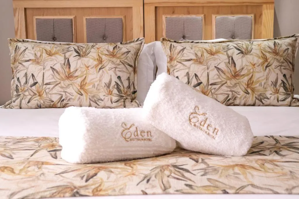 Bed in EDEN BOUTIQUE HOTEL