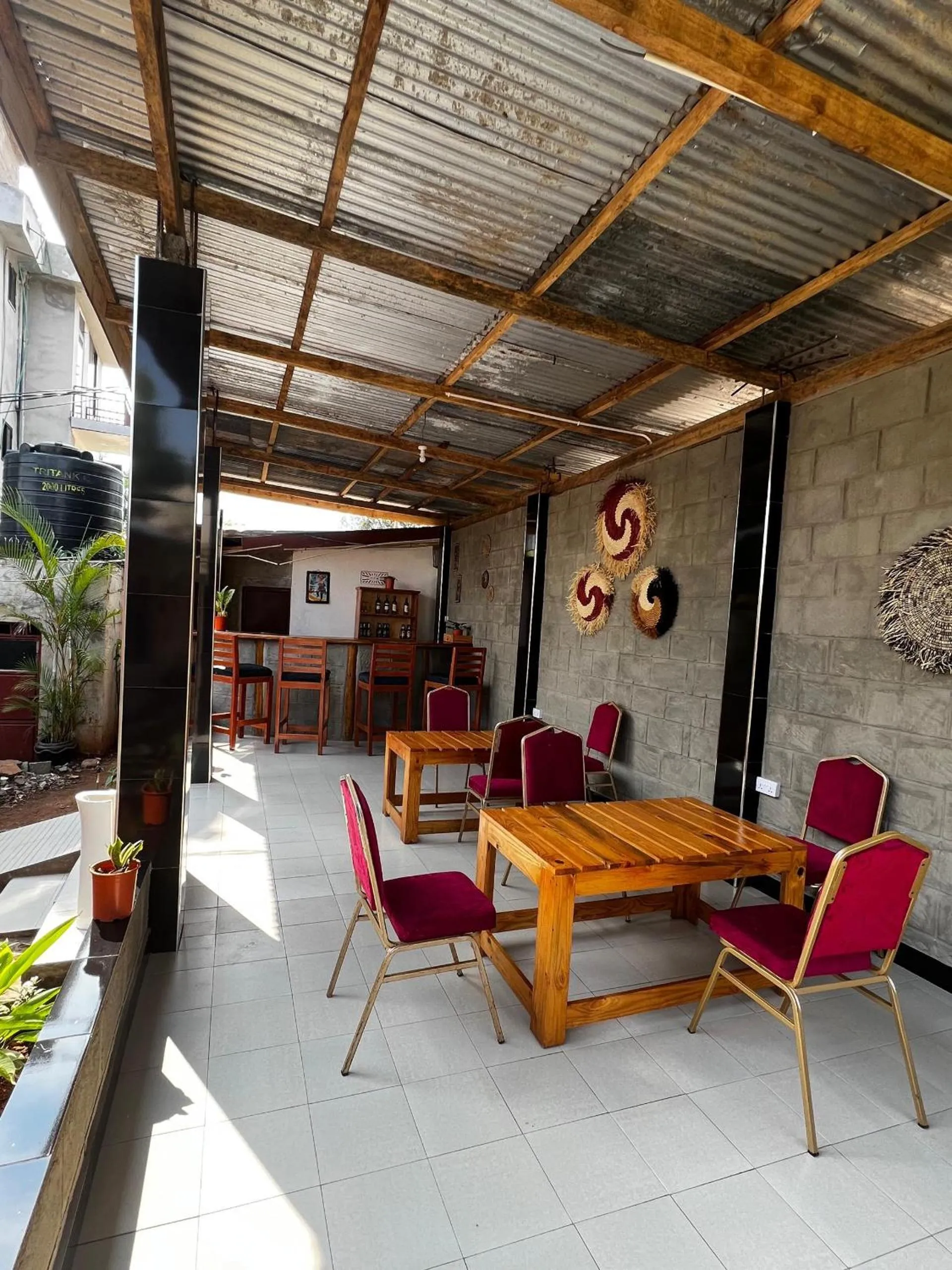 Communal lounge/ TV room in Kilimanjaro Smiley Inn