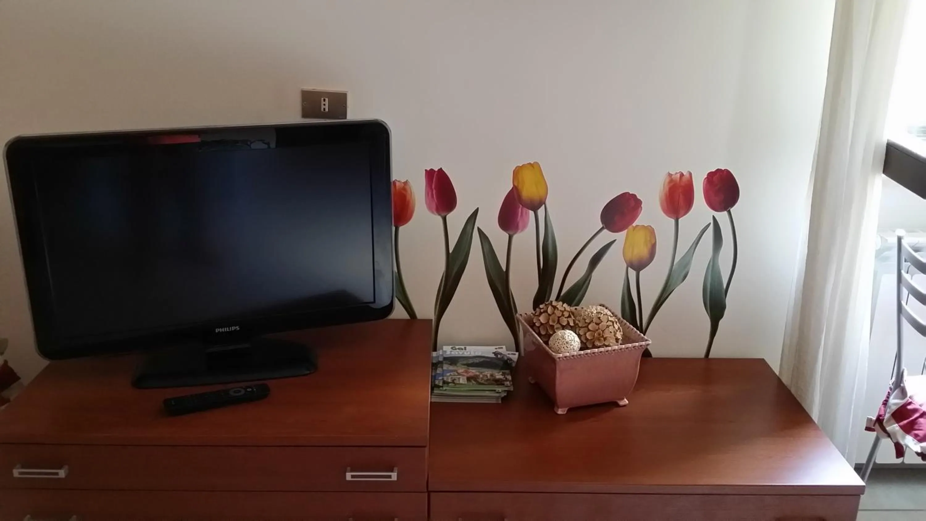 Communal lounge/ TV room in B&B il Tulipano