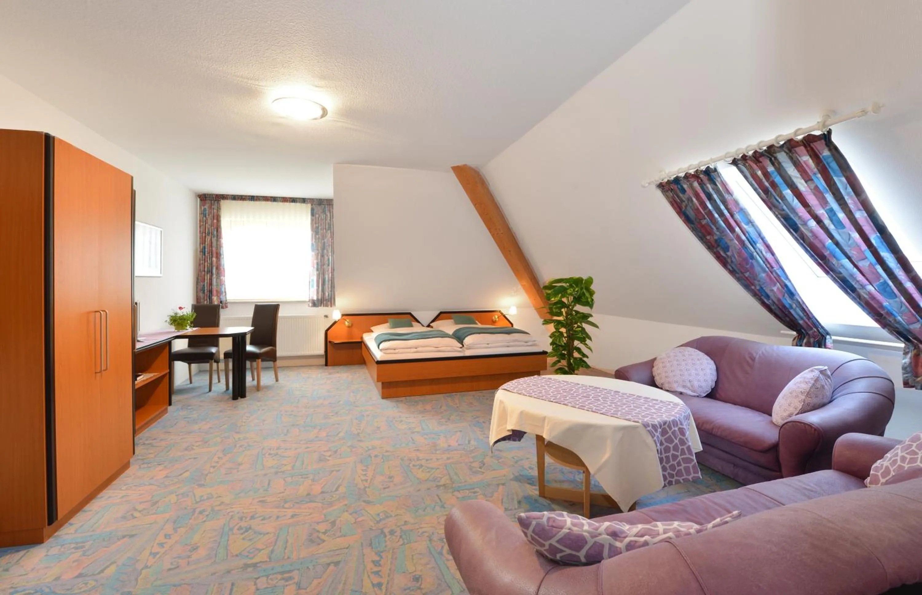 Seating area, Bed in Rhön-Hotel Sonnenhof - Restaurant & Café