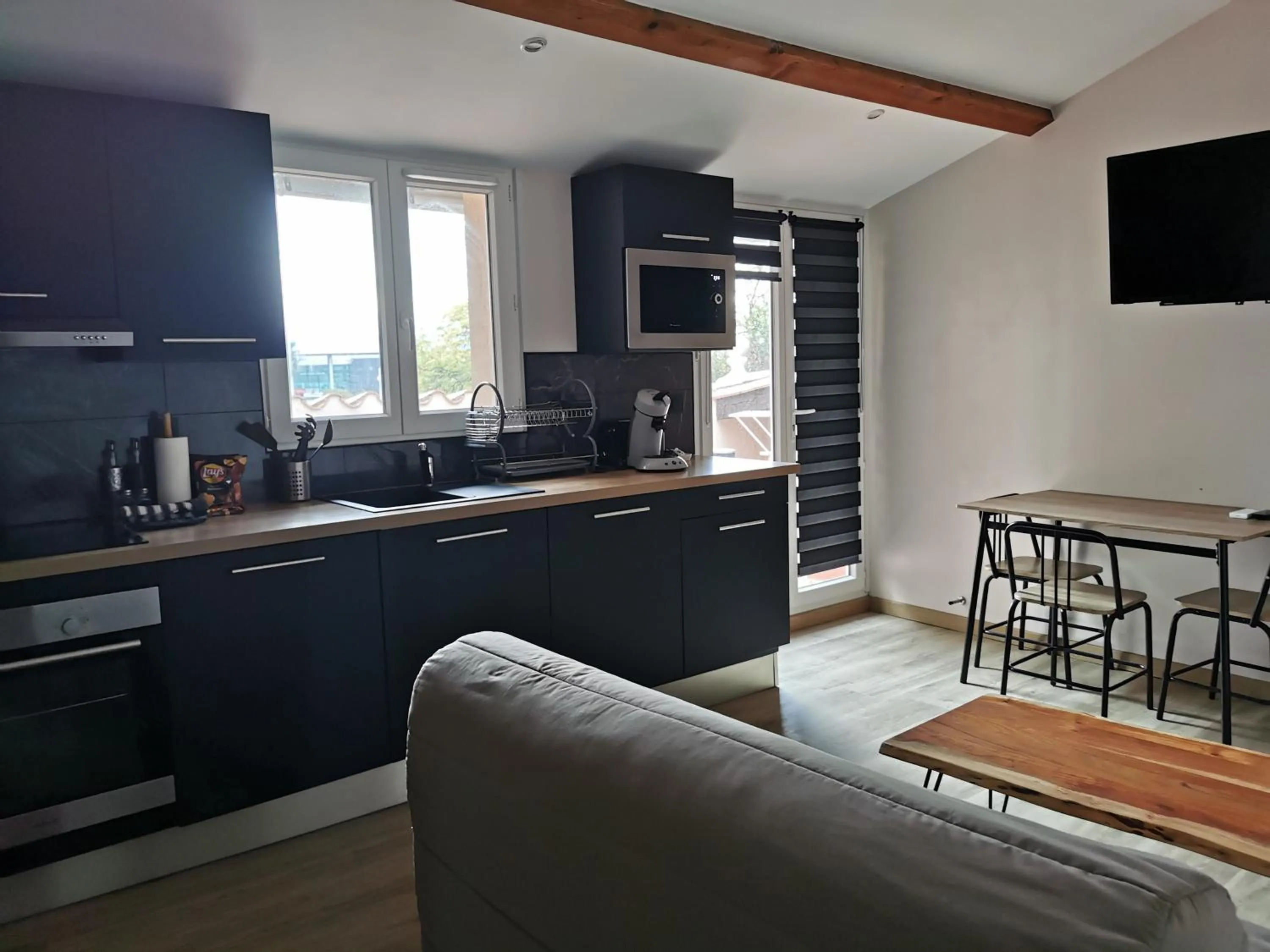 Kitchen or kitchenette in Appart Hotel Cinéma Perpignan