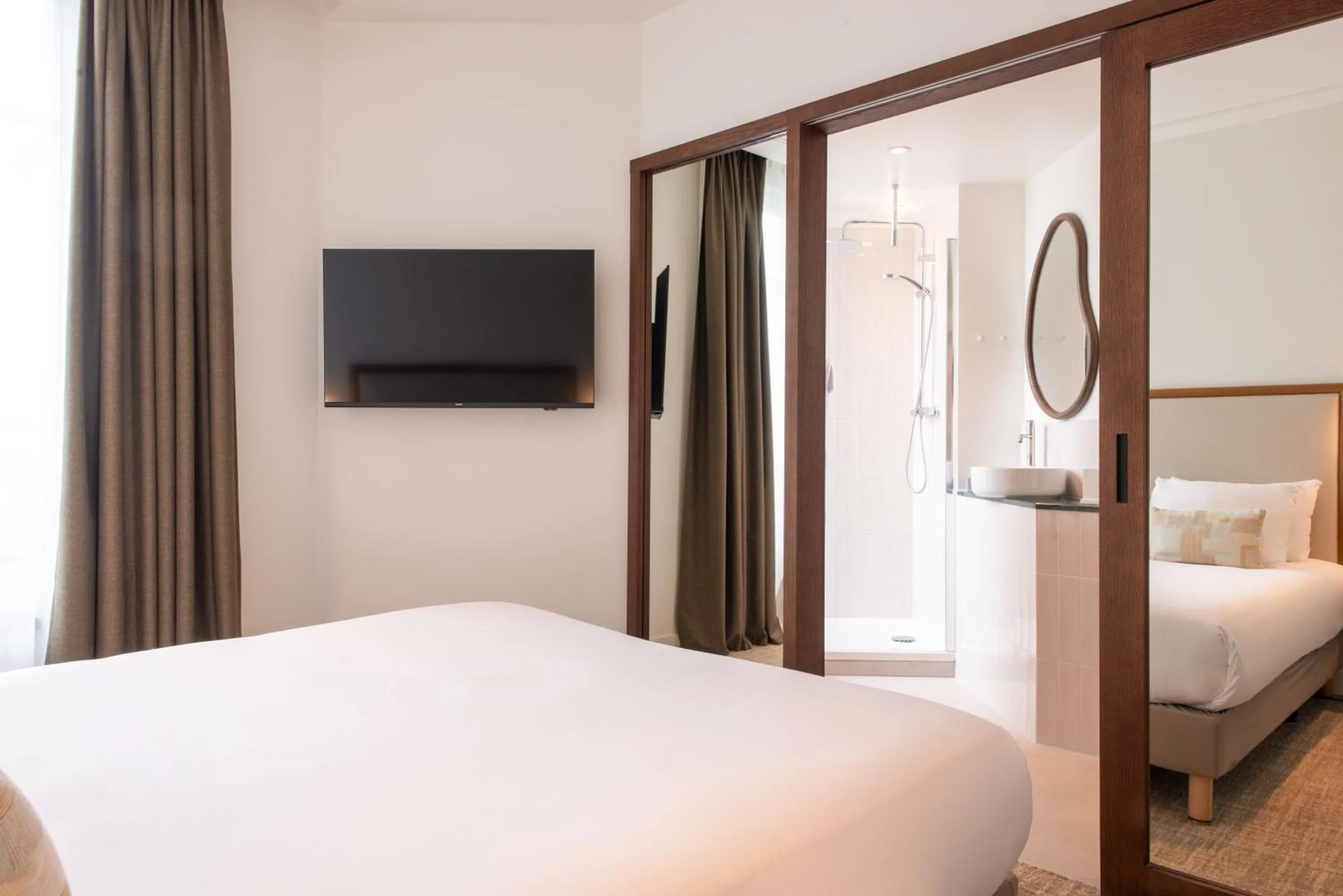 Bed in Le Lampika Hôtel