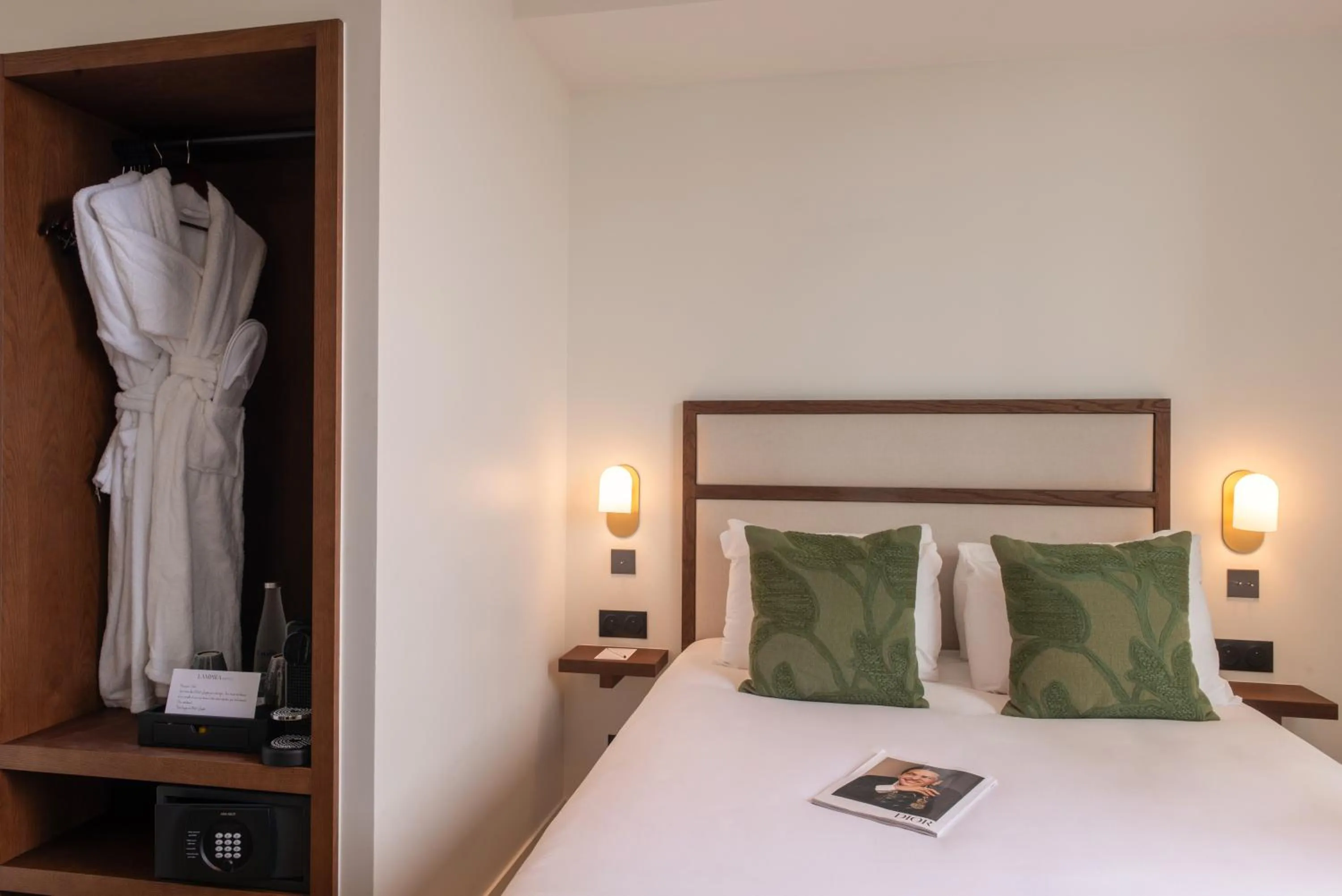 Bed in Le Lampika Hôtel