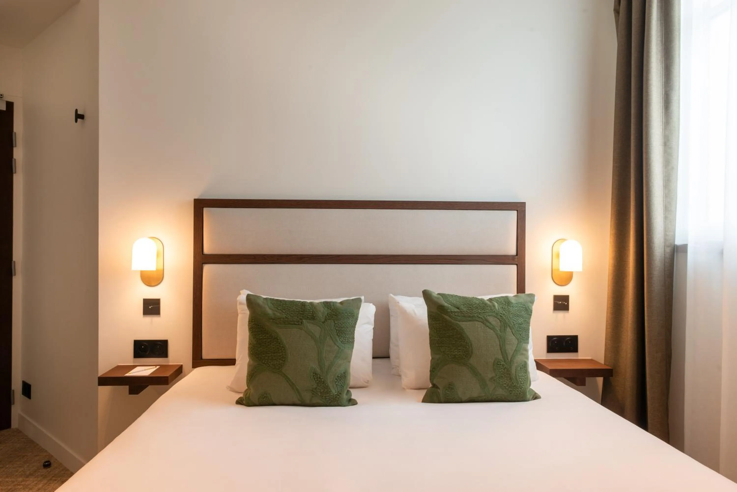 Bed in Le Lampika Hôtel