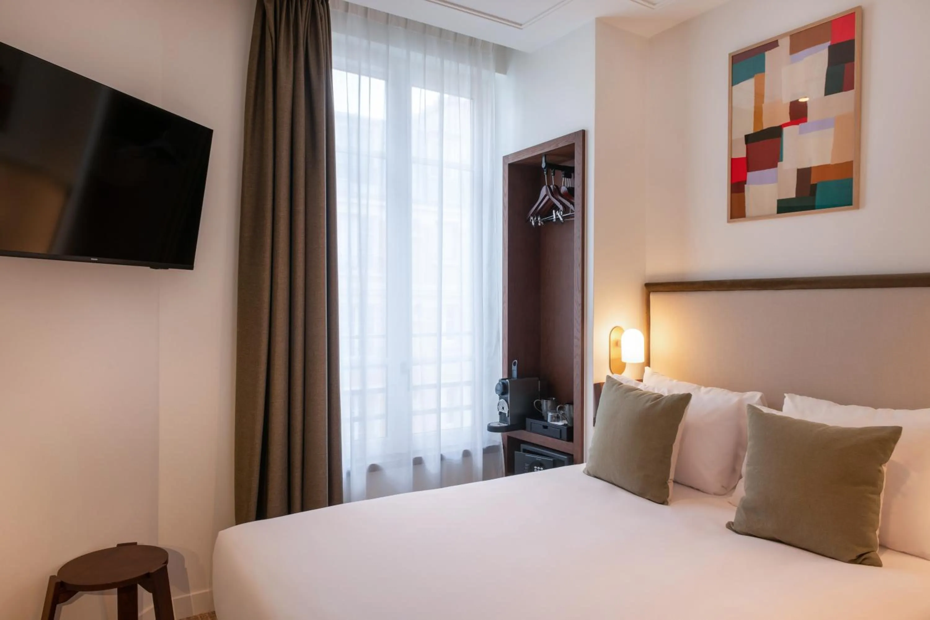 Bed in Le Lampika Hôtel